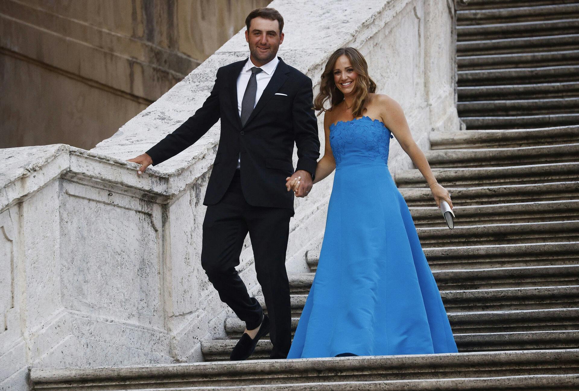 Golf - The 2023 Ryder Cup - Rome, Italy - September 27, 2023 Team USA's Scottie Scheffler and his wife Meredith Scheffler are pictured on the Spanish steps and stairs at Piazza di Spagna in Rome REUTERS/Guglielmo Mangiapane