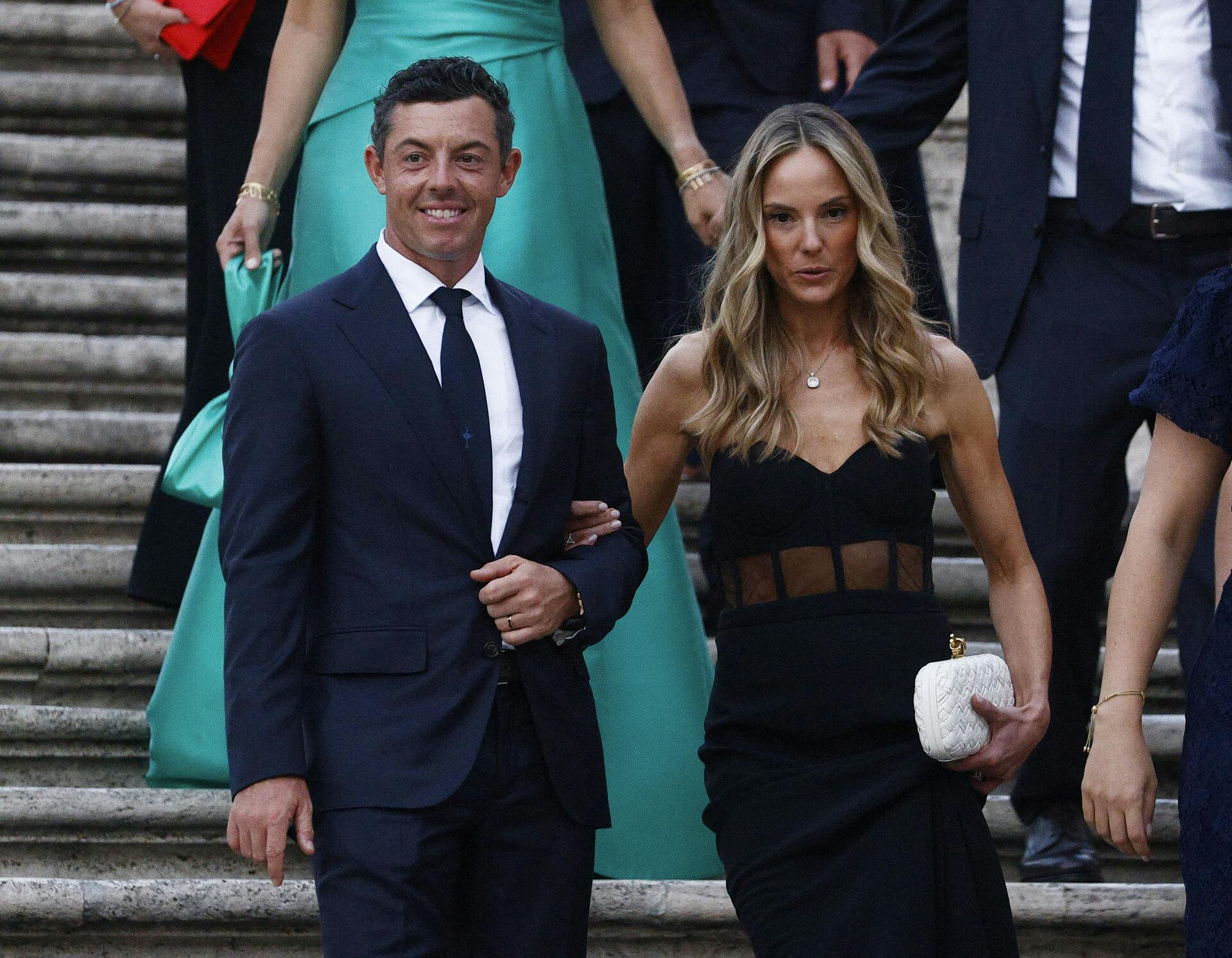 Golf - The 2023 Ryder Cup - Rome, Italy - September 27, 2023 Team Europe's Rory McIlroy and his wife Erica Stoll are pictured on the Spanish steps and stairs at Piazza di Spagna in Rome REUTERS/Guglielmo Mangiapane