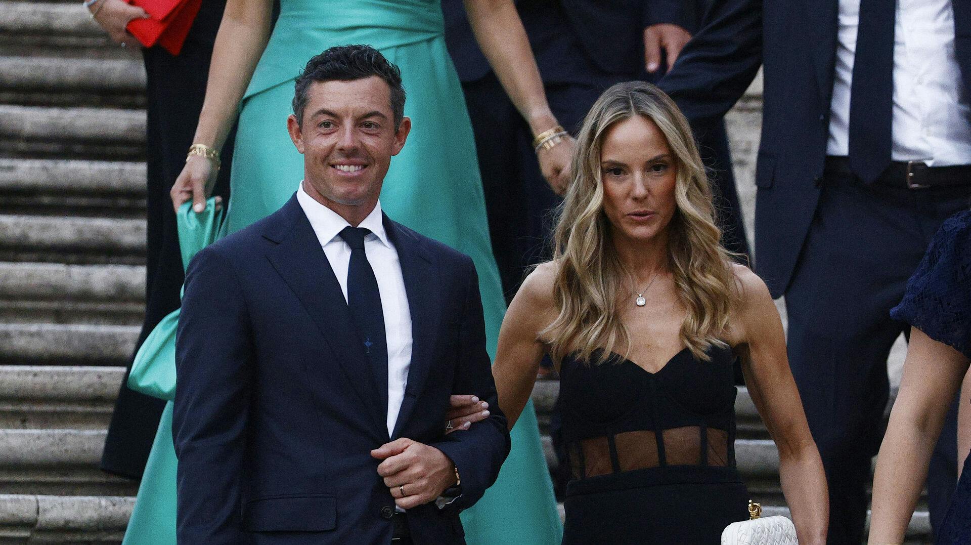 Golf - The 2023 Ryder Cup - Rome, Italy - September 27, 2023 Team Europe's Rory McIlroy and his wife Erica Stoll are pictured on the Spanish steps and stairs at Piazza di Spagna in Rome REUTERS/Guglielmo Mangiapane