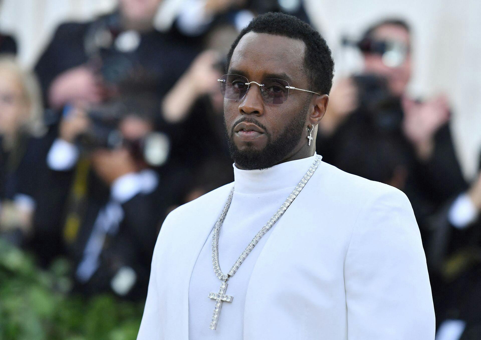 (FILES) Sean Combs 'P. Diddy' arrives for the 2018 Met Gala on May 7, 2018, at the Metropolitan Museum of Art in New York. Once hip hop's flashy impresario credited with commercializing the genre, Sean "Diddy" Combs has seen his star plunge as federal authorities raid his homes amid sex trafficking accusations and assault lawsuits. (Photo by ANGELA WEISS / AFP)