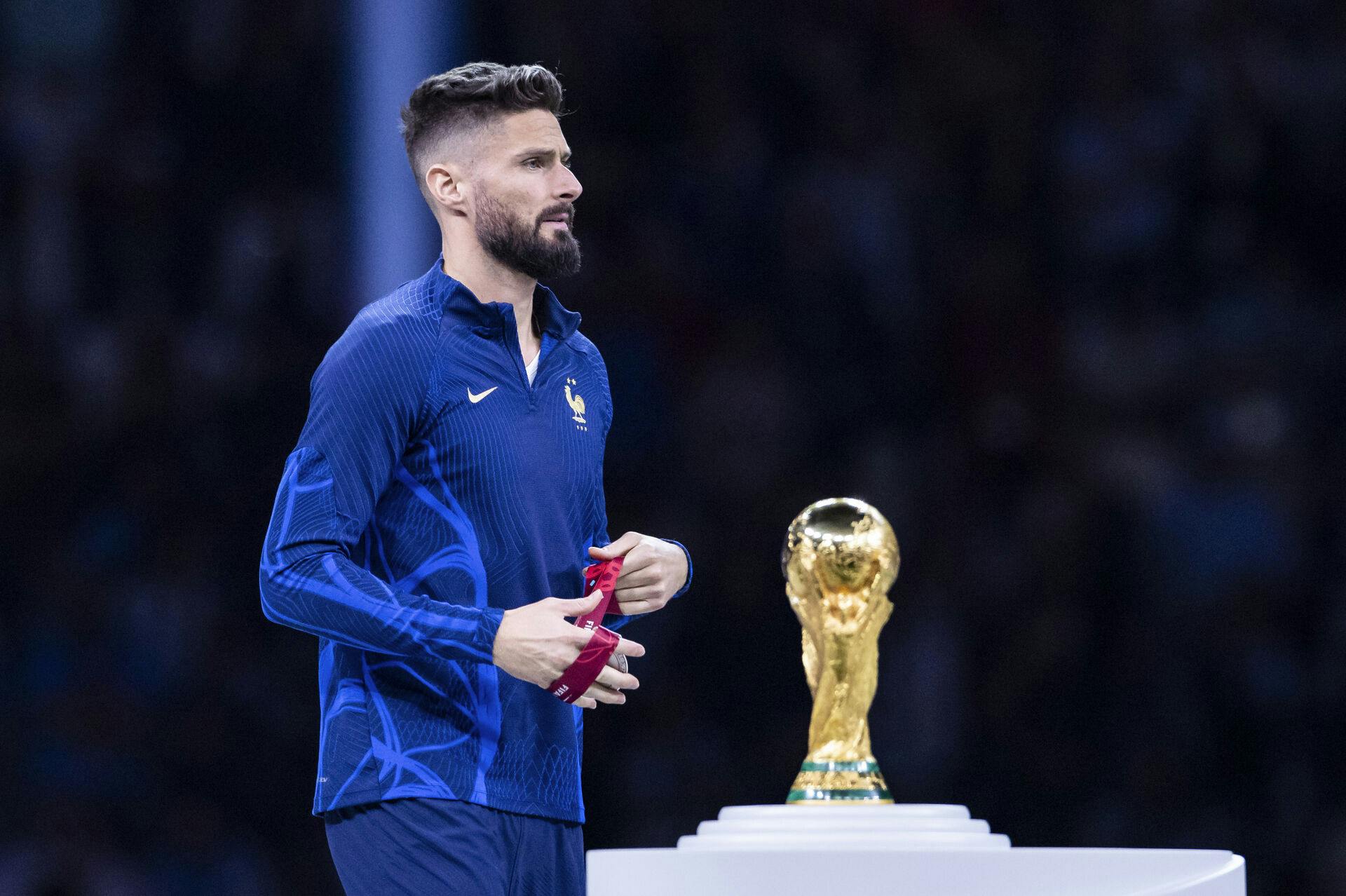 18 December 2022, Qatar, Lusail: Soccer: World Cup, Argentina – France, final round, final, Lusail Stadium, France's Olivier Giroud walks past the World Cup trophy during the award ceremony. Photo by: Tom Weller/picture-alliance/dpa/AP Images