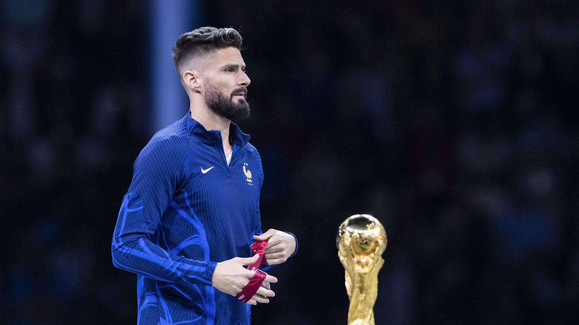 18 December 2022, Qatar, Lusail: Soccer: World Cup, Argentina – France, final round, final, Lusail Stadium, France's Olivier Giroud walks past the World Cup trophy during the award ceremony. Photo by: Tom Weller/picture-alliance/dpa/AP Images
