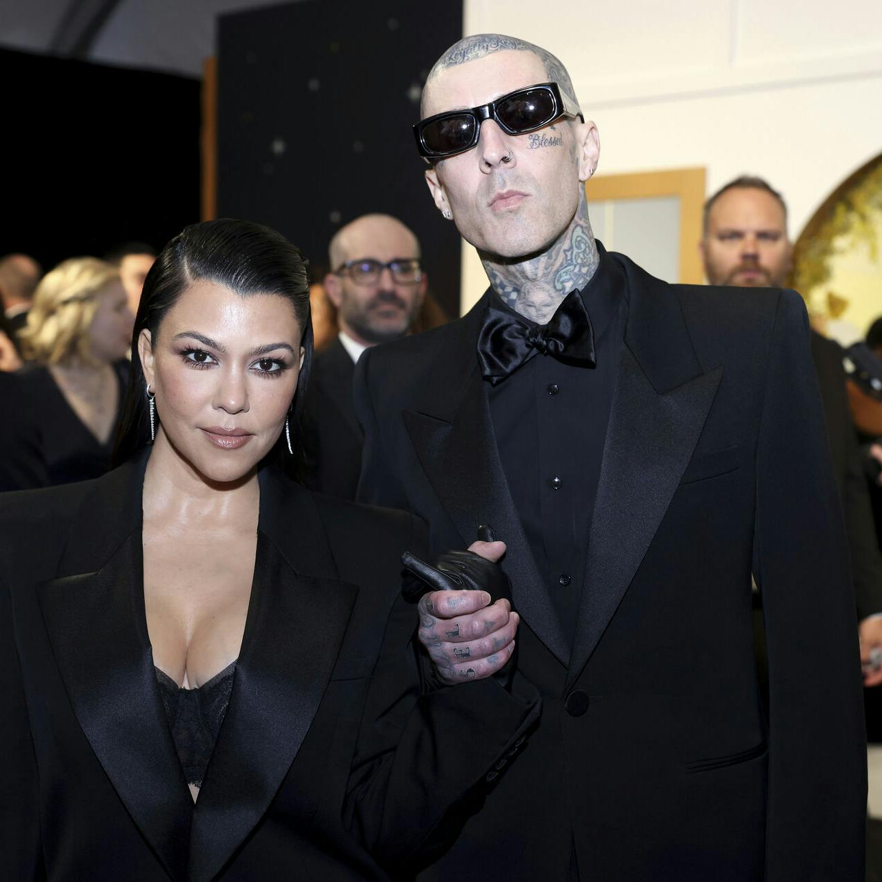 Kourtney Kardashian, left, and Travis Barker enhance their look and style at the 75th Emmy Awards on Monday, Jan. 15, 2024 at the Peacock Theater at L.A. Live in Los Angeles. (Photo by Colin Young-Wolff/Invision for the Television Academy/AP Images)