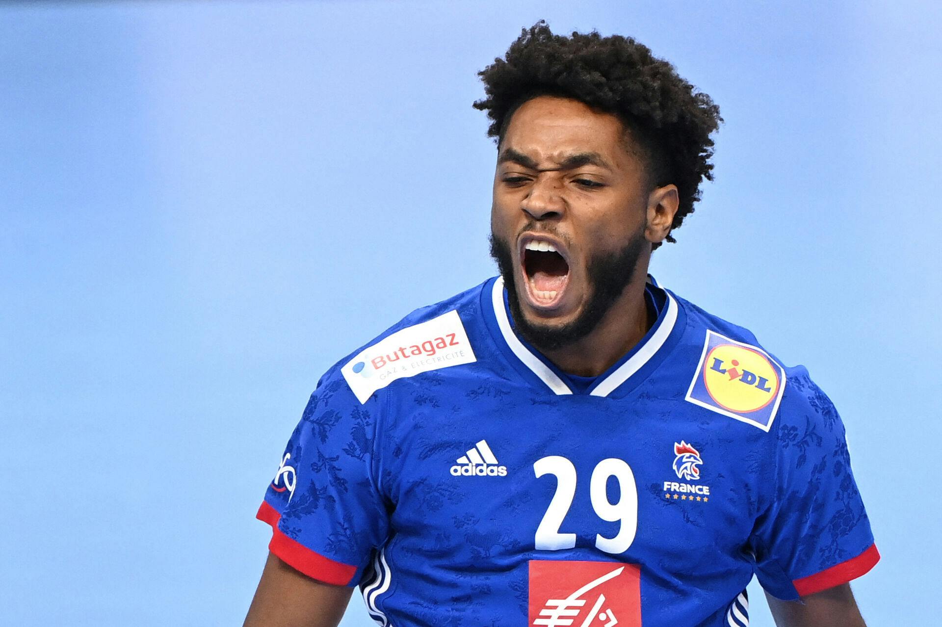 France's Benoit Kounkoud celebrates his score during the Men's European Handball Championship match for 3rd place between Denmark and France in the MVM Dome arena in Budapest, Hungary, on January 30, 2022. Attila KISBENEDEK / AFP