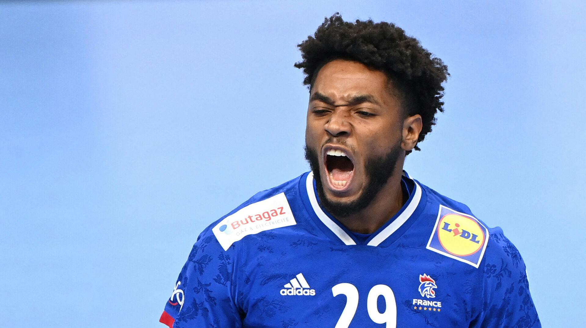 France's Benoit Kounkoud celebrates his score during the Men's European Handball Championship match for 3rd place between Denmark and France in the MVM Dome arena in Budapest, Hungary, on January 30, 2022. Attila KISBENEDEK / AFP