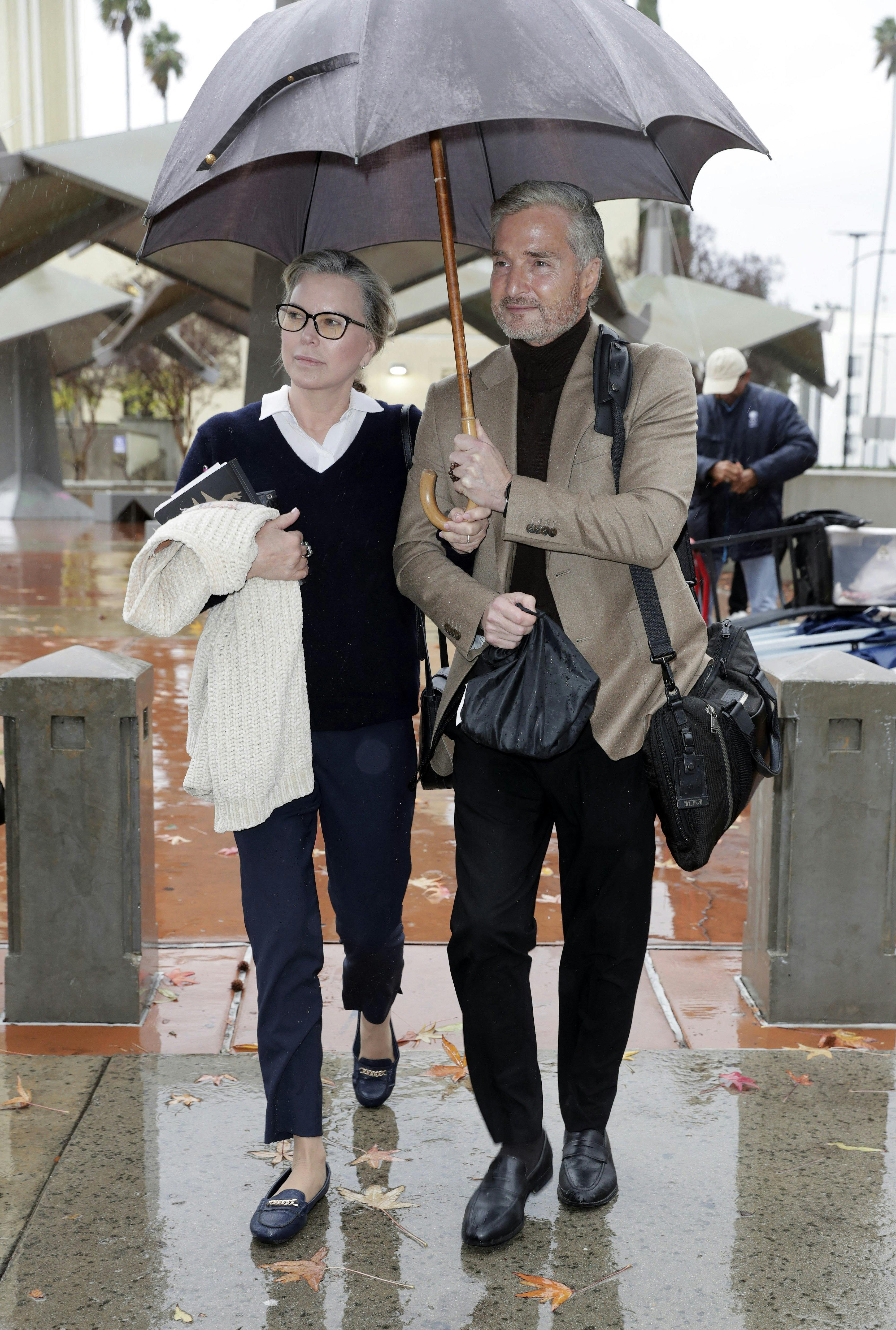 Rebecca Grossman and husband Dr Peter Grossman arrive at the Los Angeles County Supreme Court - Van Nuys on February 1, 2024 in Los Angeles, California. As day five of the tragic trial started it was pouring with rain as an atmospheric river came down on California. 01 Feb 2024 Pictured: Rebecca Grossman, Dr Peter Grossman. Photo credit: RC / MEGA TheMegaAgency.com +1 888 505 6342 (Mega Agency TagID: MEGA1090590_003.jpg) [Photo via Mega Agency]