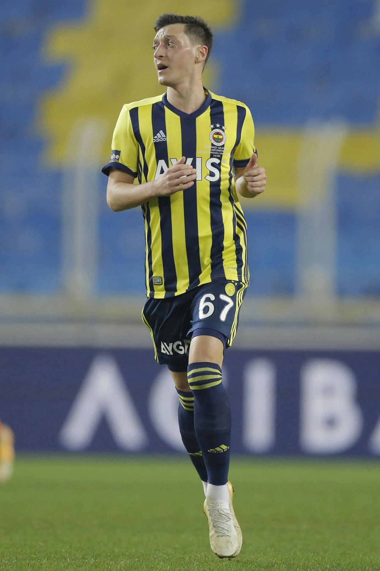 Fenerbahce's German midfielder Mesut Ozil runs during the Turkish Super League (Super Lig) football match between Fenerbahce S.K. and Galatasaray S.K. at The Sukru Saracoglu Stadium in Istanbul on February 6, 2021. Kenan Asyali / POOL / AFP
