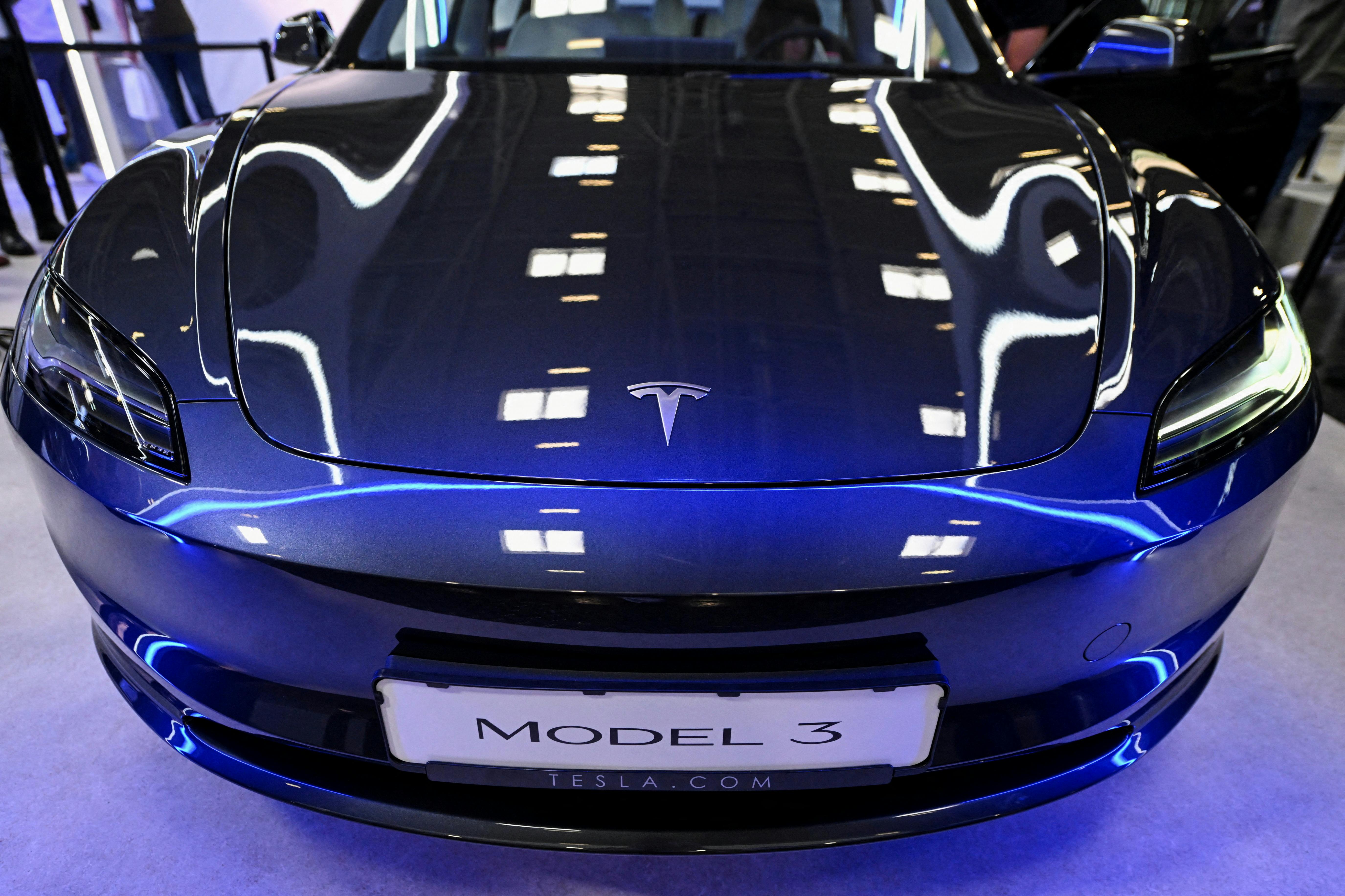 FILE PHOTO: Tesla's Model 3 is displayed during an event a day ahead of the official opening of the 2023 Munich Auto Show IAA Mobility, in Munich, Germany, September 4, 2023. REUTERS/Angelika Warmuth/File Photo