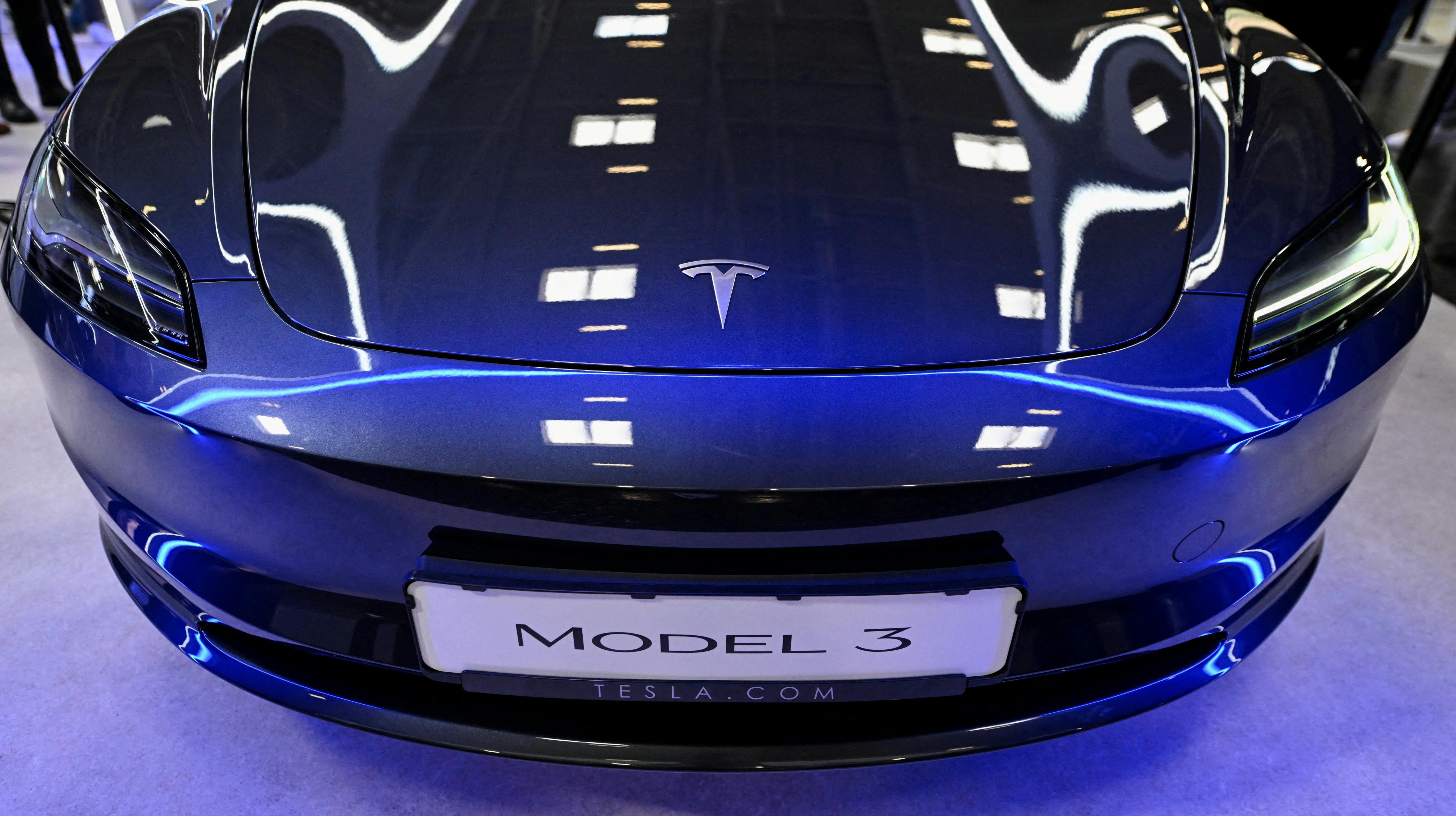 FILE PHOTO: Tesla's Model 3 is displayed during an event a day ahead of the official opening of the 2023 Munich Auto Show IAA Mobility, in Munich, Germany, September 4, 2023. REUTERS/Angelika Warmuth/File Photo