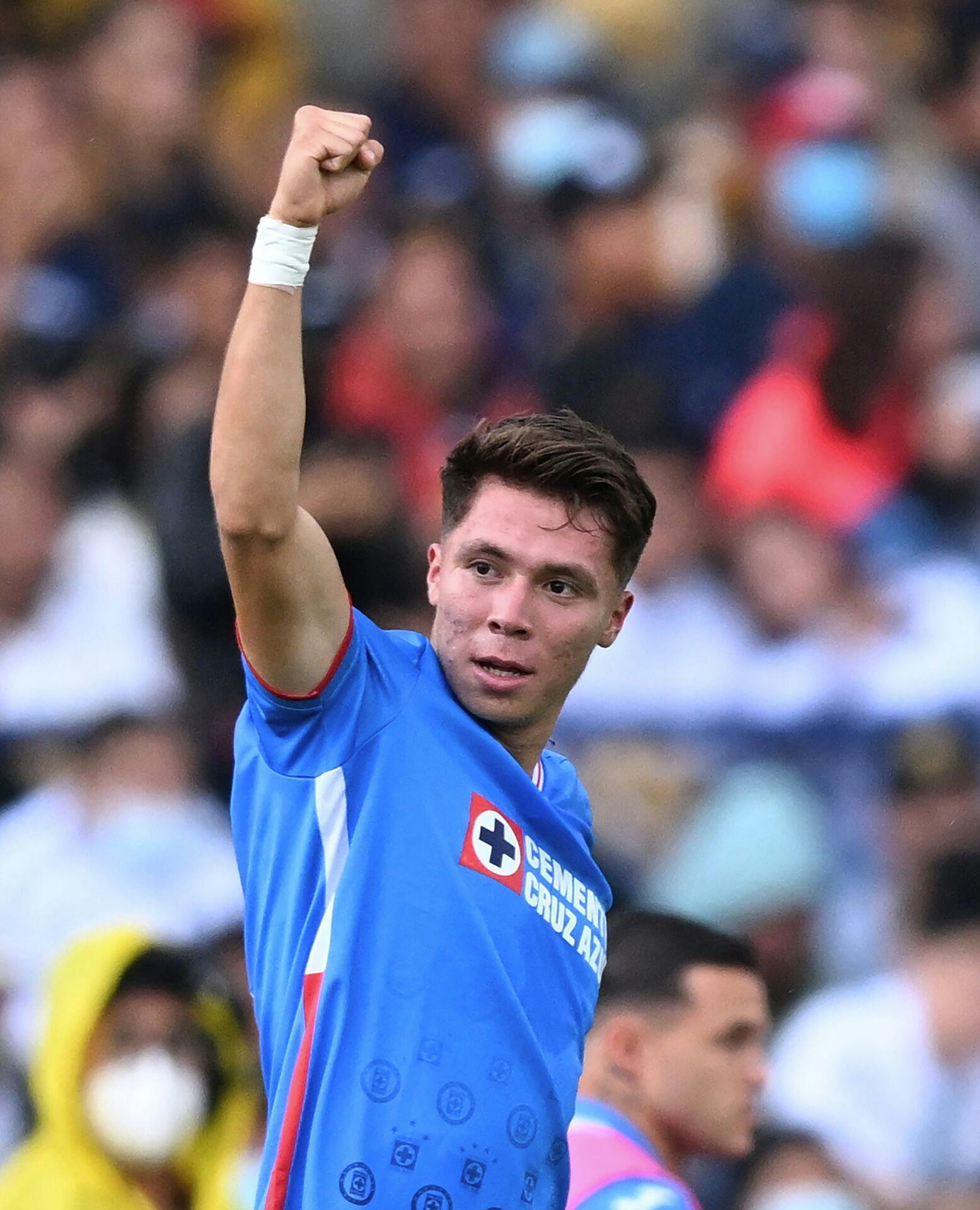 Cruz Azul's Rodrigo Huescas celebrates after scoring againsts Pumas during the Mexican Apertura football tournament match between Pumas and Cruz Azul at the Olimpico stadium in Mexico City, on September 18, 2022. RODRIGO ARANGUA / AFP