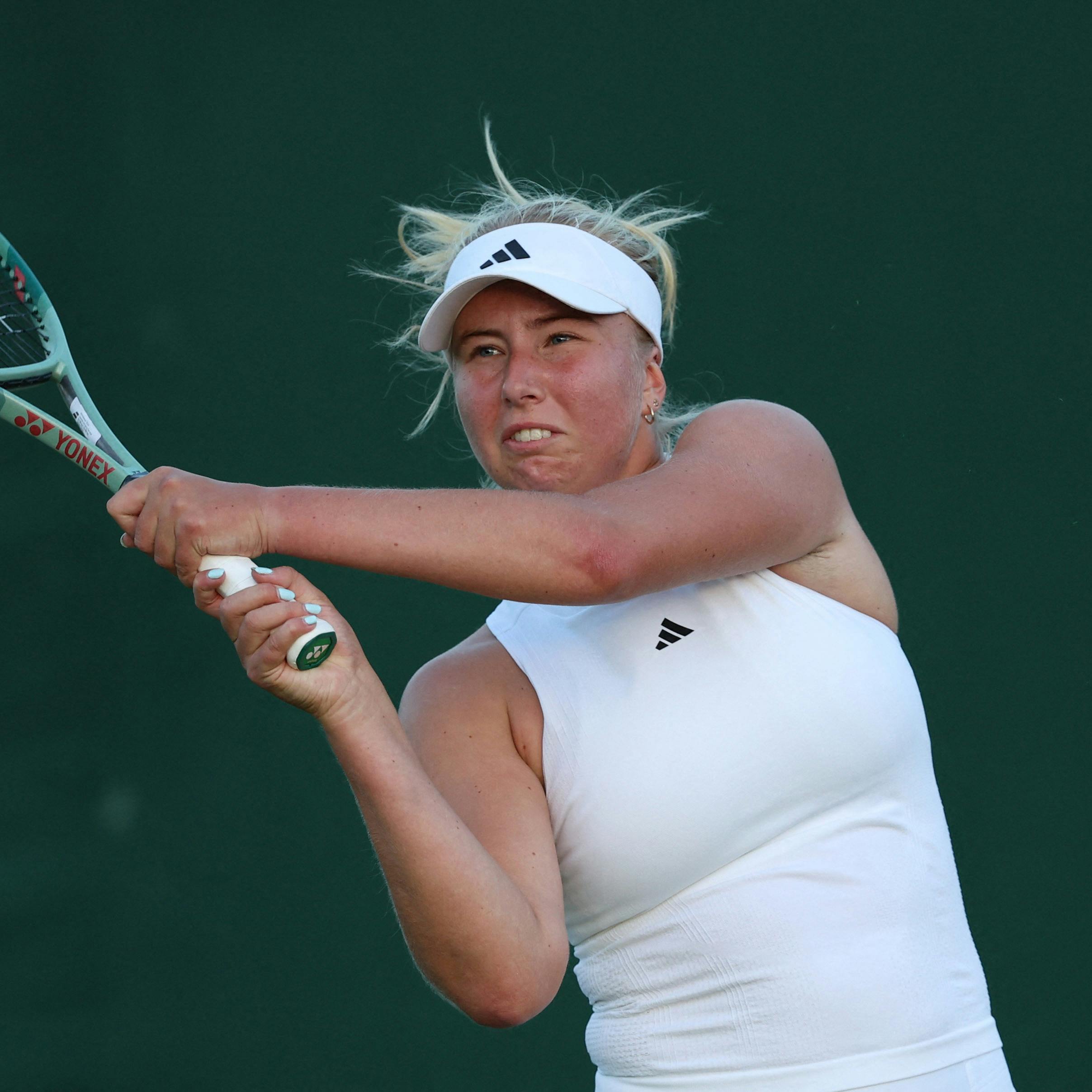 Tennis - Wimbledon - All England Lawn Tennis and Croquet Club, London, Britain - July 2, 2024 Denmark's Clara Tauson in action during her first round match against Danielle Collins of the U.S. REUTERS/Paul Childs