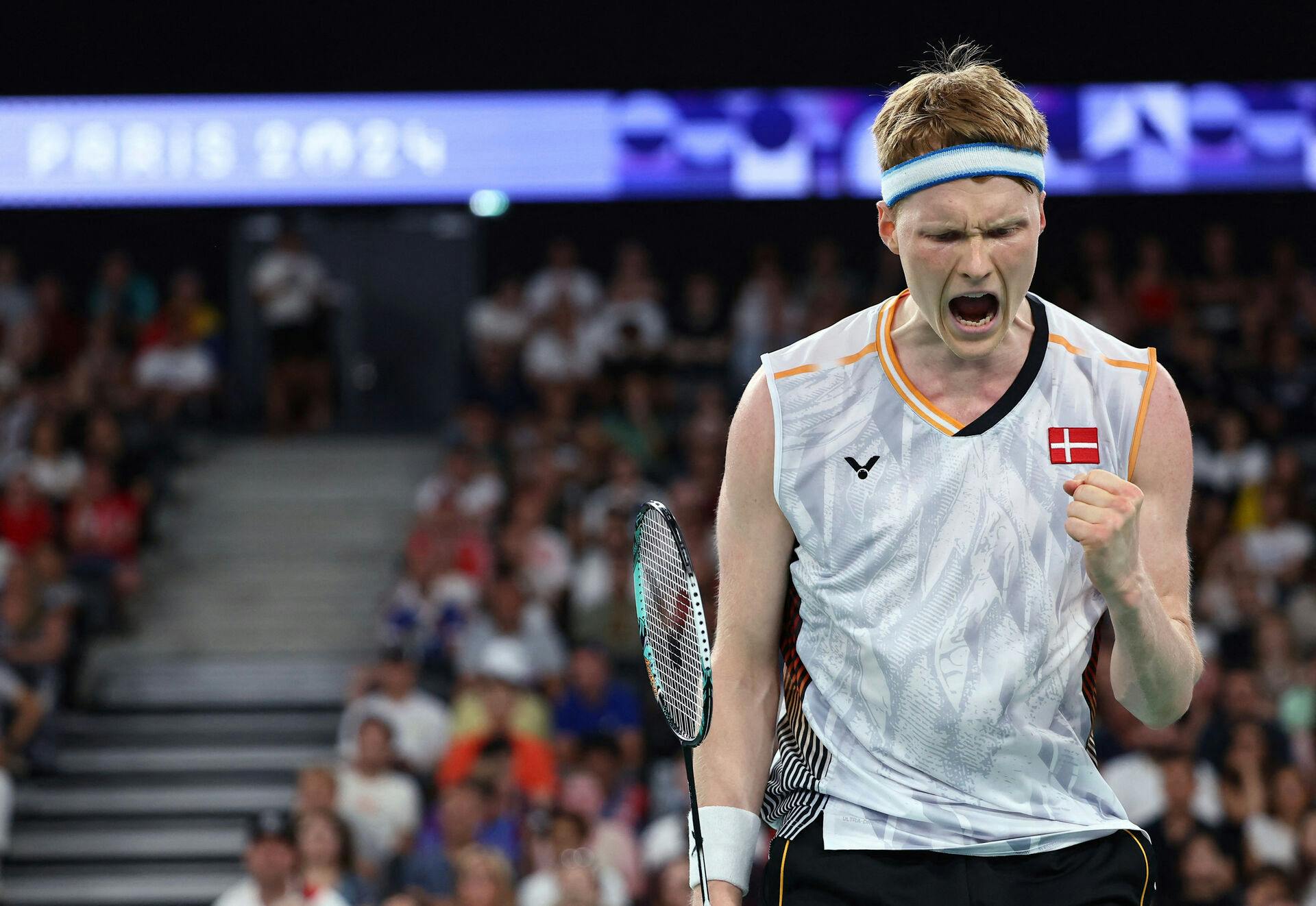 Paris 2024 Olympics - Badminton - Men's Singles Group play stage - Porte de La Chapelle Arena, Paris, France - July 28, 2024. Anders Antonsen of Denmark reacts during the Group E match against Collins Valentine Filimon of Austria. REUTERS/Ann Wang