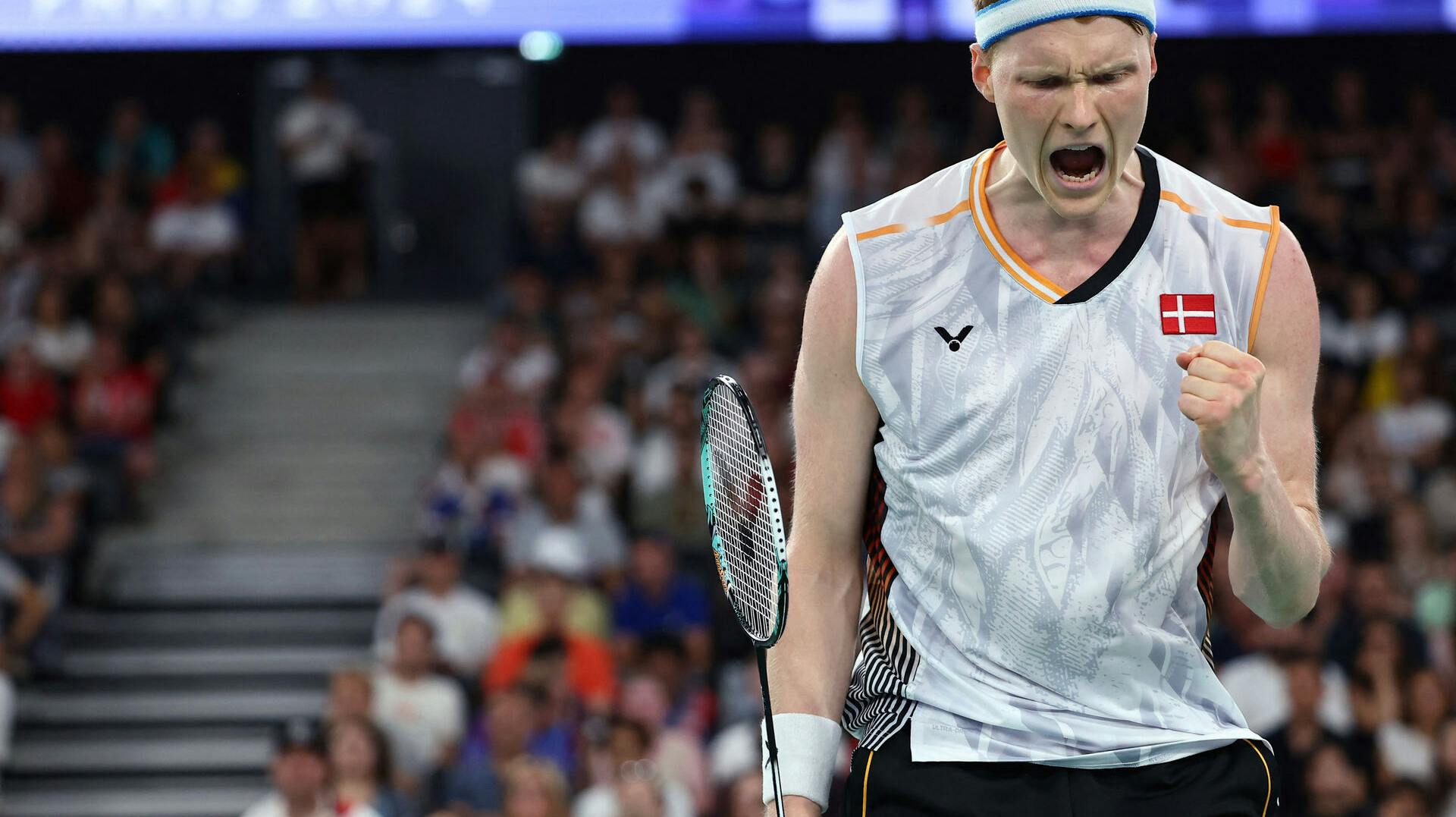 Paris 2024 Olympics - Badminton - Men's Singles Group play stage - Porte de La Chapelle Arena, Paris, France - July 28, 2024. Anders Antonsen of Denmark reacts during the Group E match against Collins Valentine Filimon of Austria. REUTERS/Ann Wang