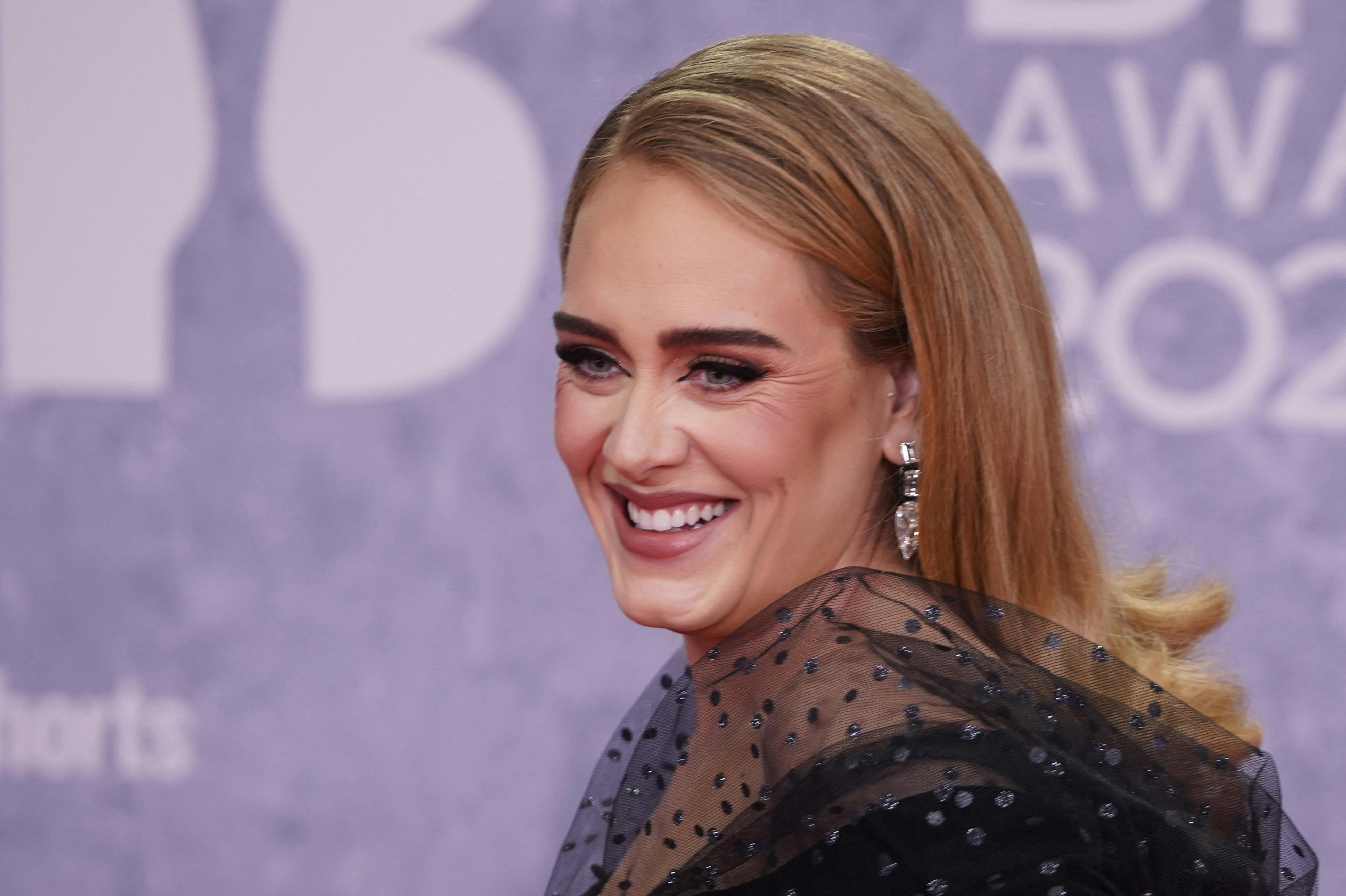 British singer Adele Laurie Blue Adkins aka Adele poses on the red carpet upon her arrival for the BRIT Awards 2022 in London on February 8, 2022. Niklas HALLE'N / AFP