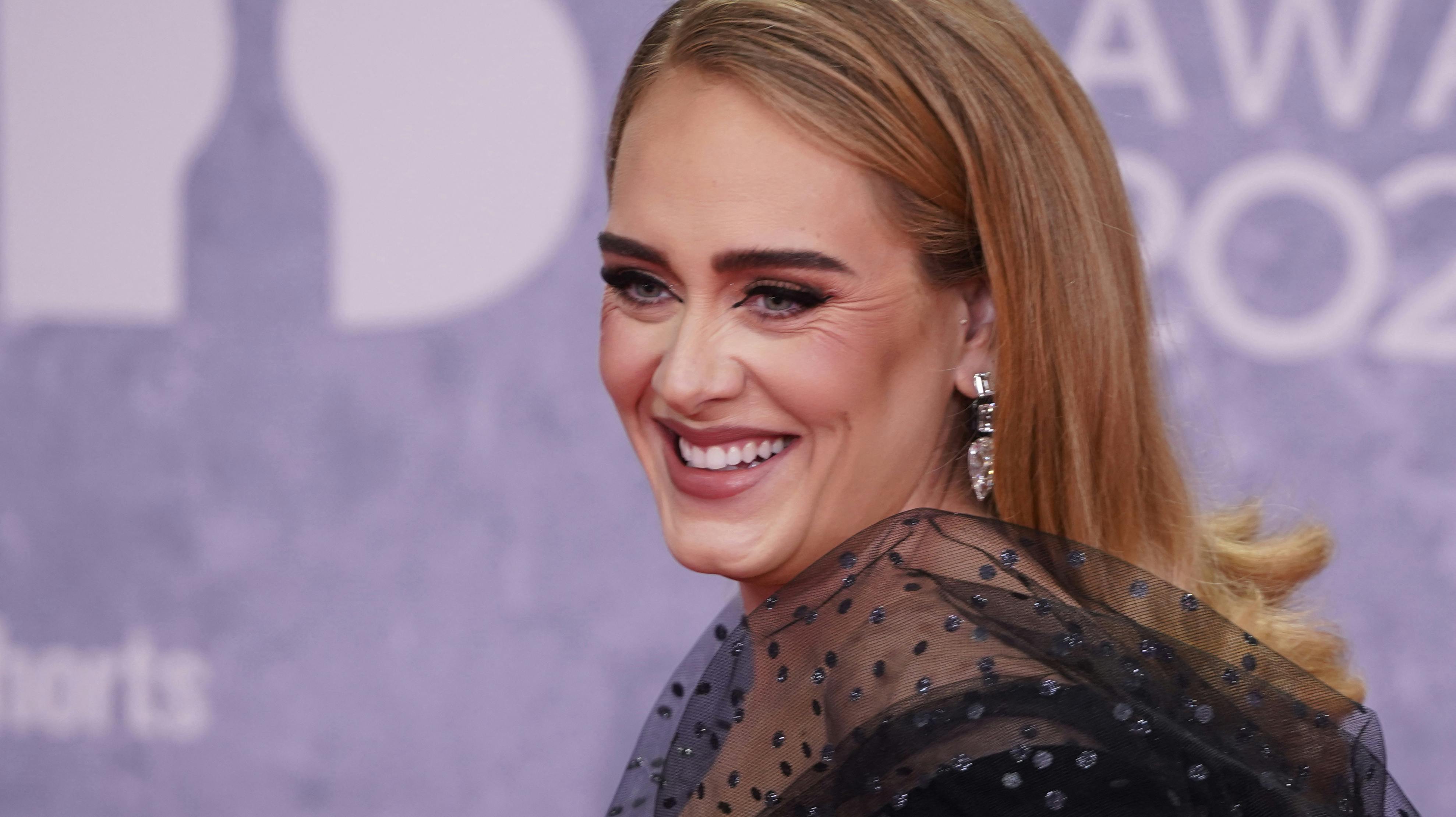 British singer Adele Laurie Blue Adkins aka Adele poses on the red carpet upon her arrival for the BRIT Awards 2022 in London on February 8, 2022. Niklas HALLE'N / AFP