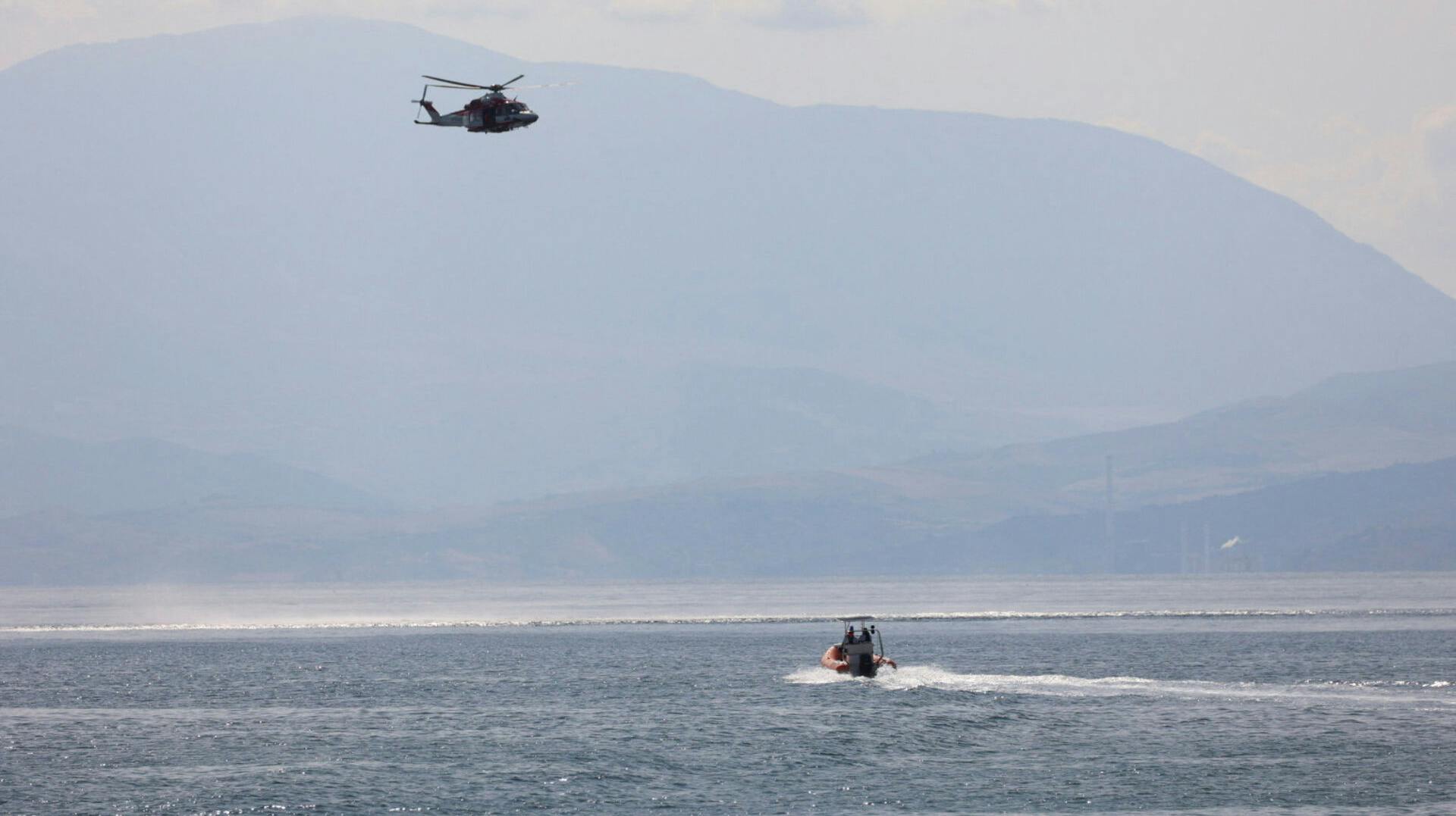 Emergency and rescue services work near the scene where a sailboat sank in the early hours of Monday off the coast of Porticello, near the Sicilian city of Palermo, Italy, August 19, 2024. REUTERS/Igor Petyx