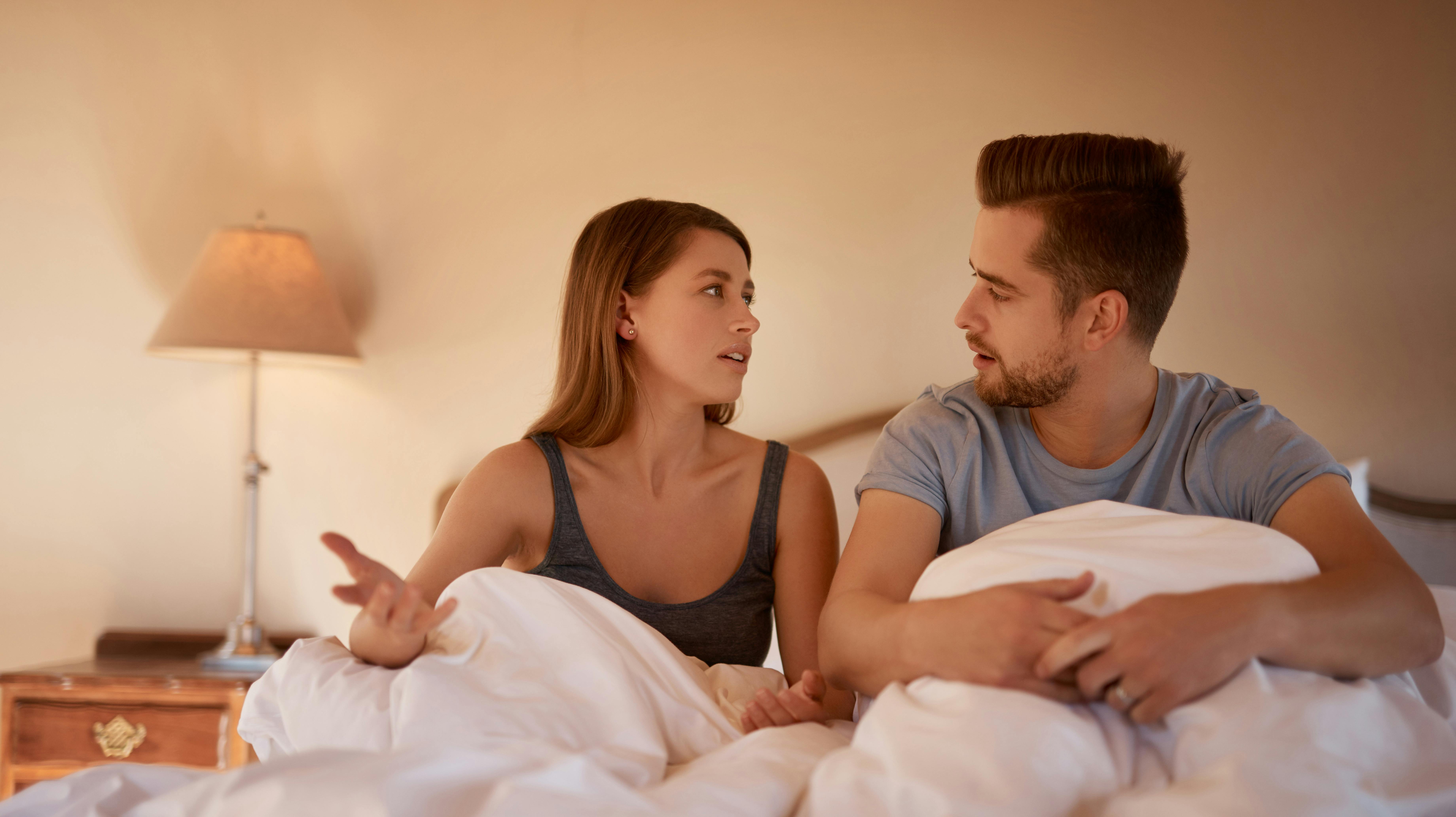 Divorce, stress and couple fight in bed with anger, blame and jealousy, insomnia or frustrated at home. Marriage, conflict or bedroom drama, disagree or argue for snoring, noise or sleep apnea crisis.