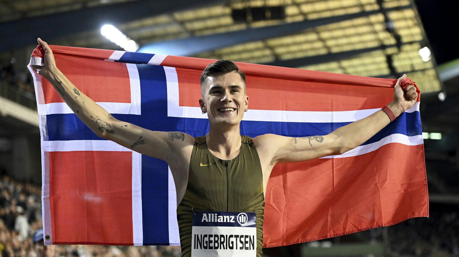Jakob Ingebrigtsen, of Norway, celebrates after winning the men's 1500 meters during the Diamond League final 2024 athletics meet in Brussels, Friday, Sept. 13, 2024. (AP Photo/Frederic Sierakowski)