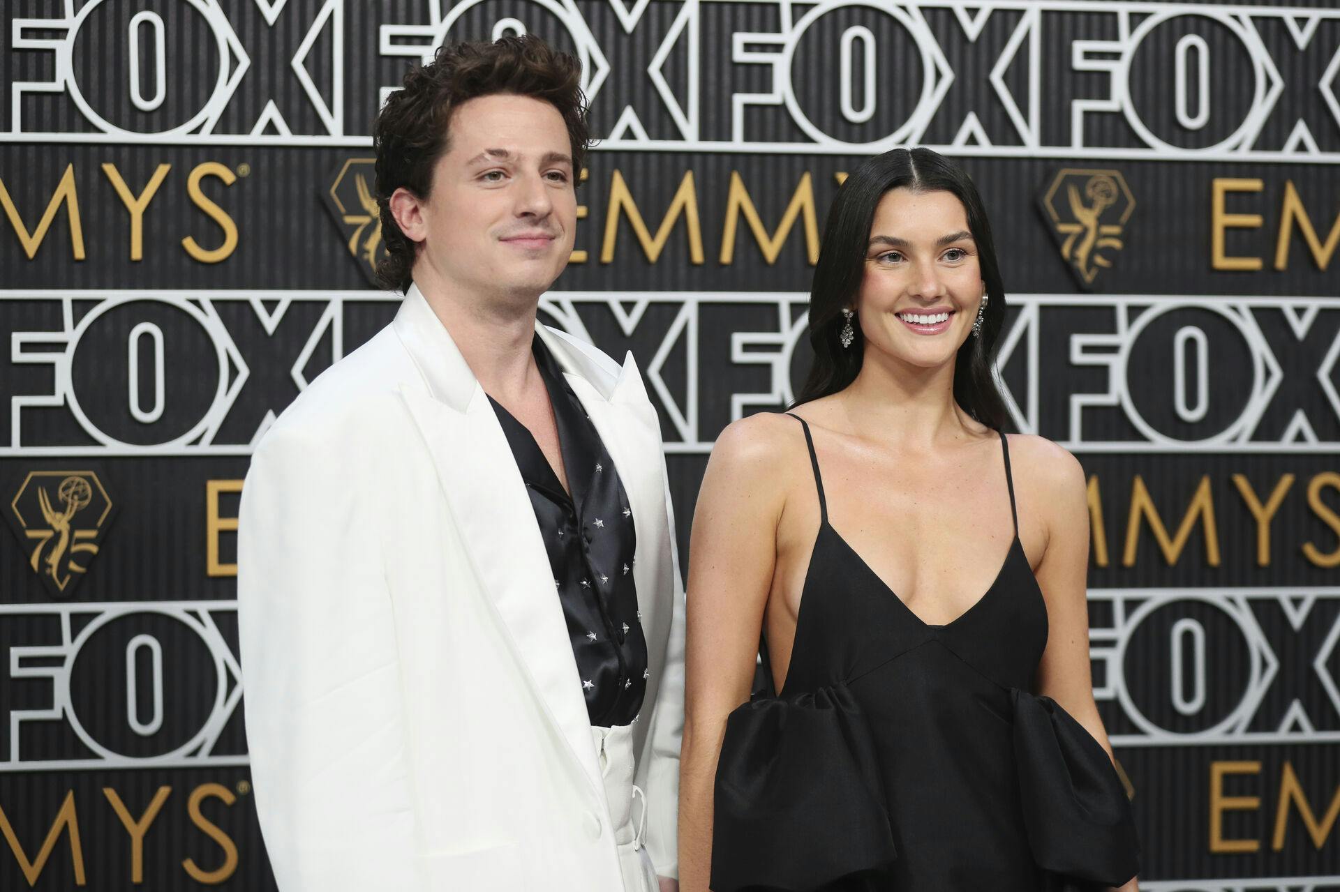 Charlie Puth, left, and Brooke Sansone pose for a Red Carpet portrait at the 75th Emmy Awards on Monday, Jan. 15, 2024 at the Peacock Theater in Los Angeles. (Photo by Danny Moloshok/Invision for the Television Academy/AP Images)