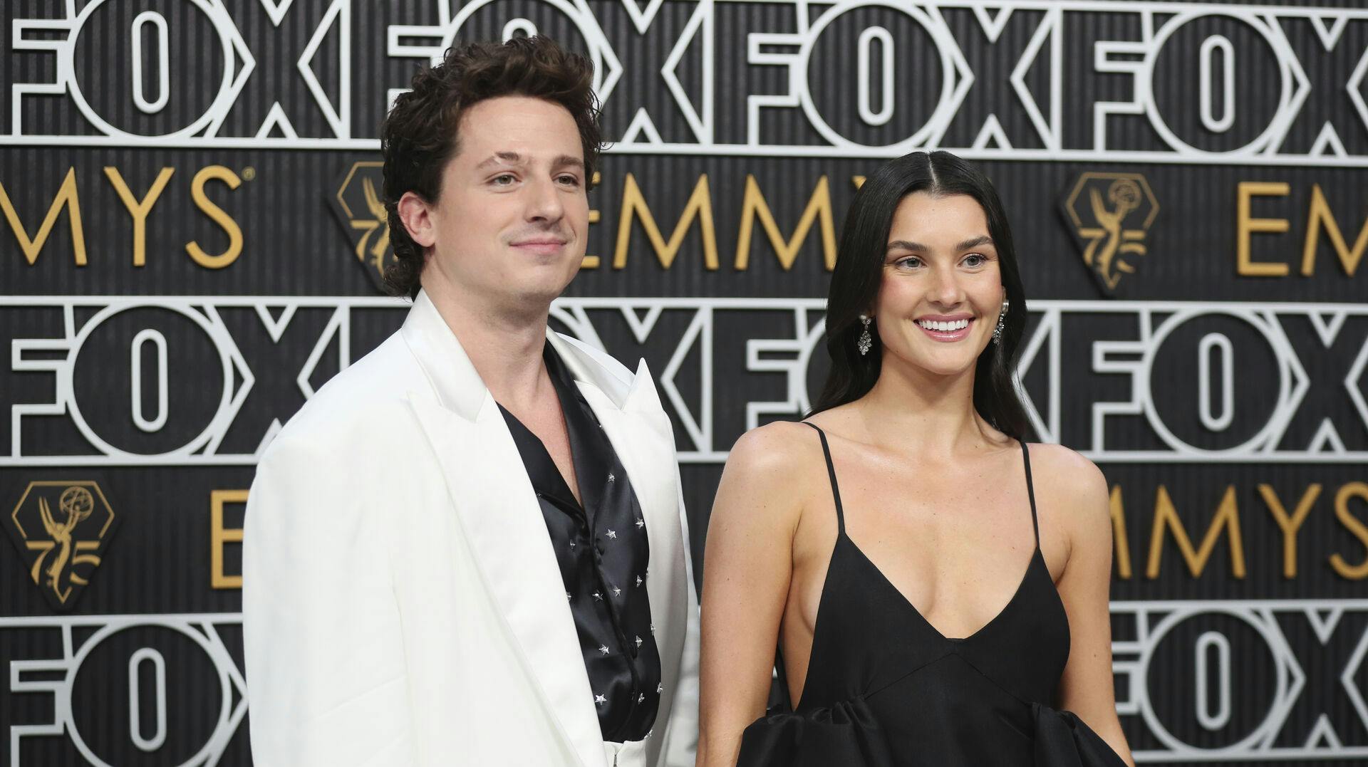 Charlie Puth, left, and Brooke Sansone pose for a Red Carpet portrait at the 75th Emmy Awards on Monday, Jan. 15, 2024 at the Peacock Theater in Los Angeles. (Photo by Danny Moloshok/Invision for the Television Academy/AP Images)