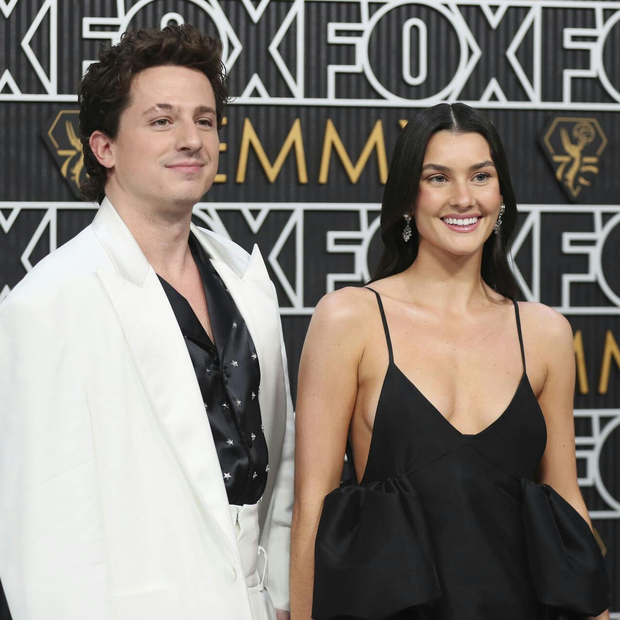 Charlie Puth, left, and Brooke Sansone pose for a Red Carpet portrait at the 75th Emmy Awards on Monday, Jan. 15, 2024 at the Peacock Theater in Los Angeles. (Photo by Danny Moloshok/Invision for the Television Academy/AP Images)