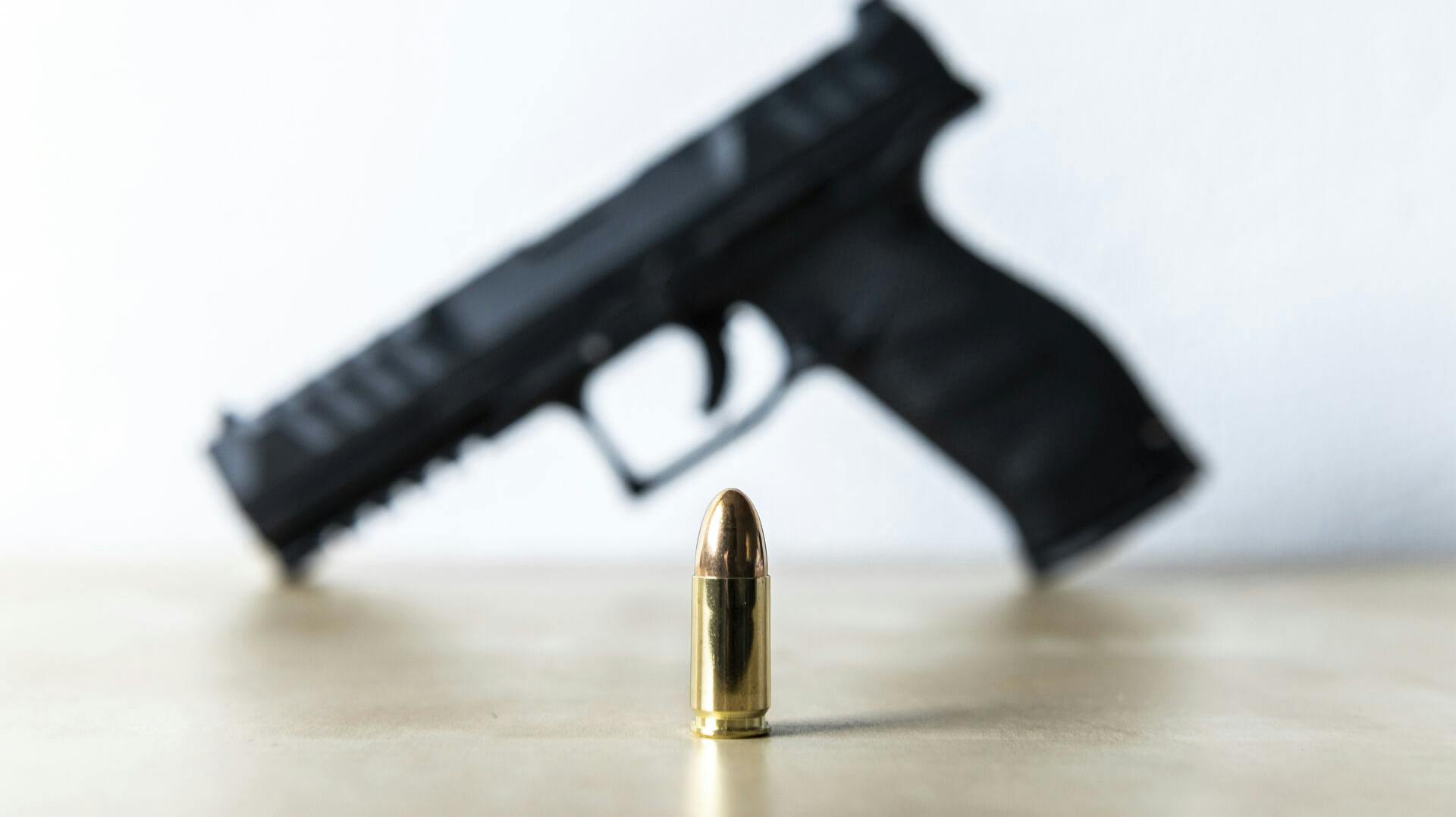 15 January 2022, Baden-Wuerttemberg, Rottweil: A 9mm cartridge stands on a table of a sport shooter. A Walther PDP Full Size 5" pistol can be seen in the background. Photo by: Silas Stein/picture-alliance/dpa/AP Images