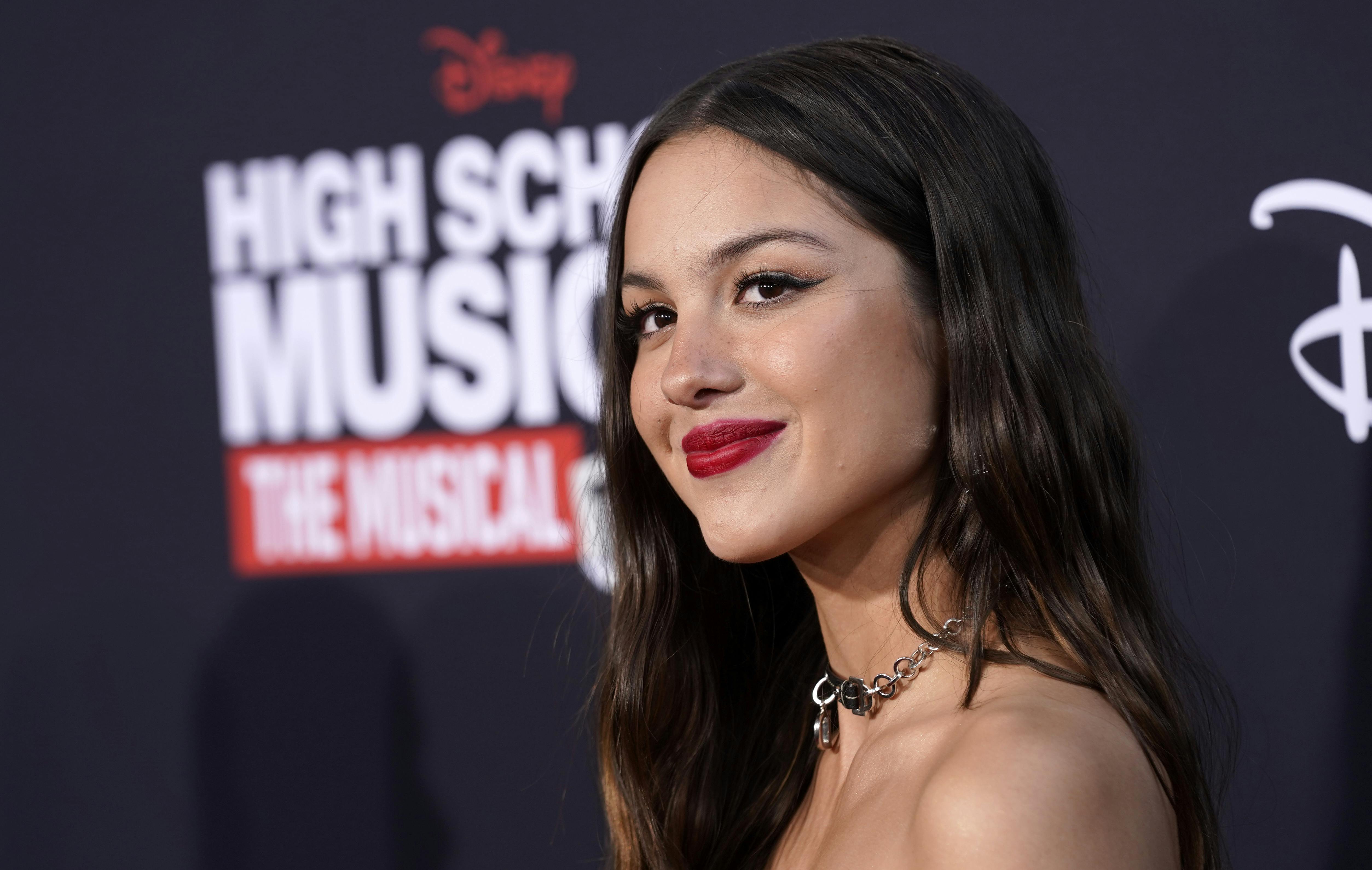 Olivia Rodrigo poses at the season three premiere of the Disney + streaming series "High School Musical: The Musical: The Series, " Wednesday, July 27, 2022, at Walt Disney Studios in Burbank, Calif. (AP Photo/Chris Pizzello)