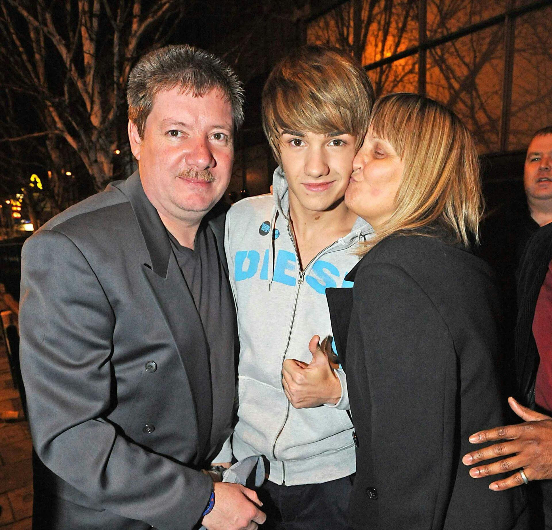 Liam Payne with father Geoff and mother Karen