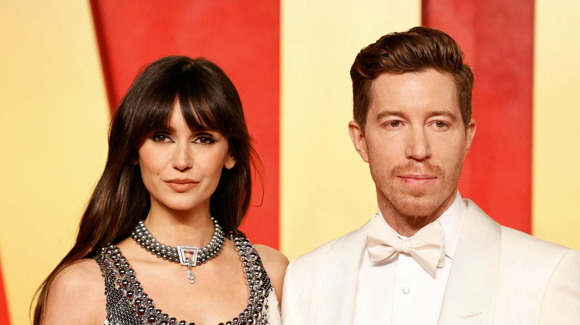 Canadian actress Nina Dobrev (L) and US former snowboarder Shaun White attend the Vanity Fair Oscars Party at the Wallis Annenberg Center for the Performing Arts in Beverly Hills, California, on March 10, 2024. (Photo by Michael TRAN / AFP)