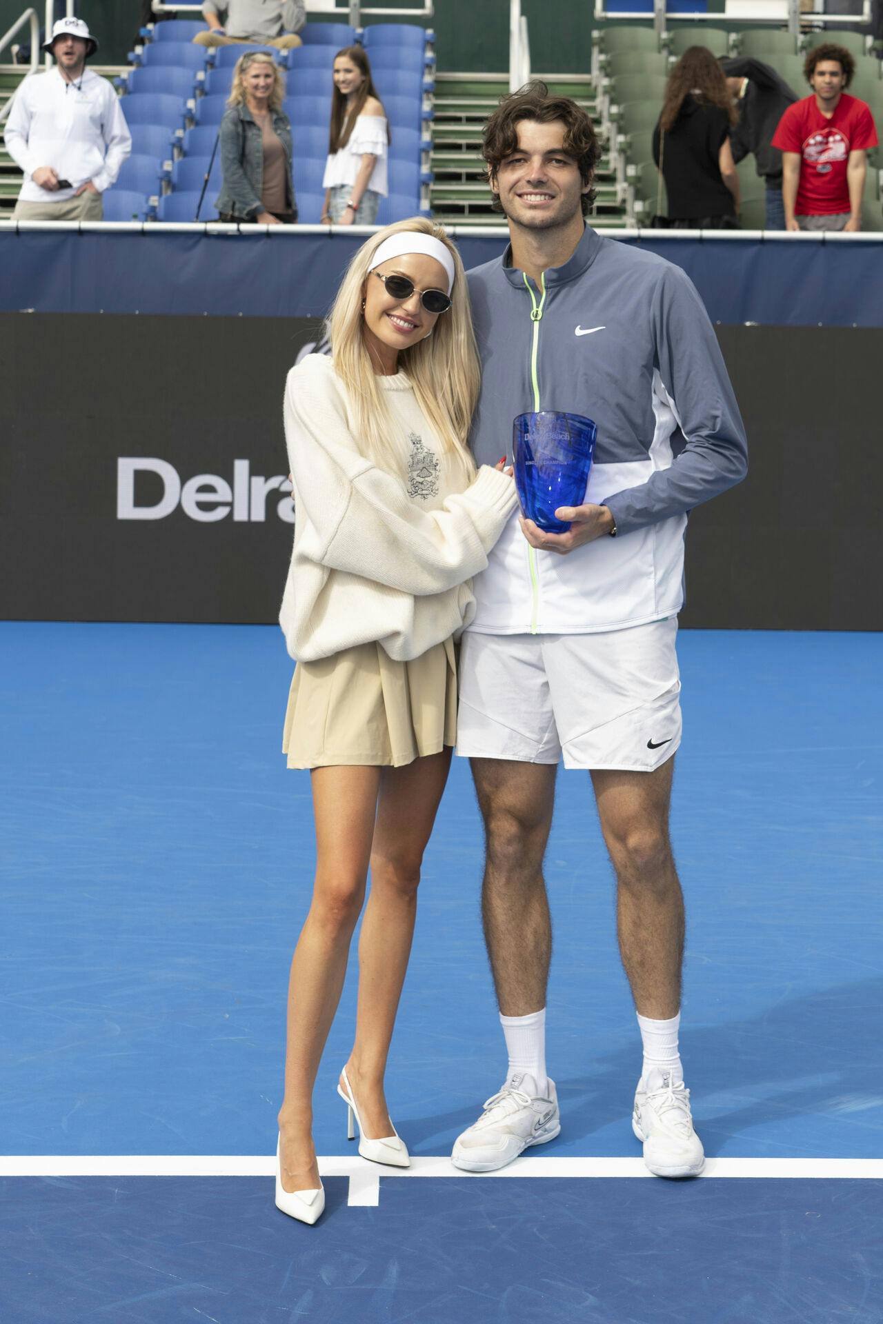 DELRAY BEACH, FL - FEBRUARY 19: Morgan Riddle poses with Taylor Fritz (USA) after he wins the 2024 Delray Beach Open on February 19, 2024, at the Delray Beach Tennis Center in Delray Beach, Florida. Credit: Andrew Patron/MediaPunch /IPX