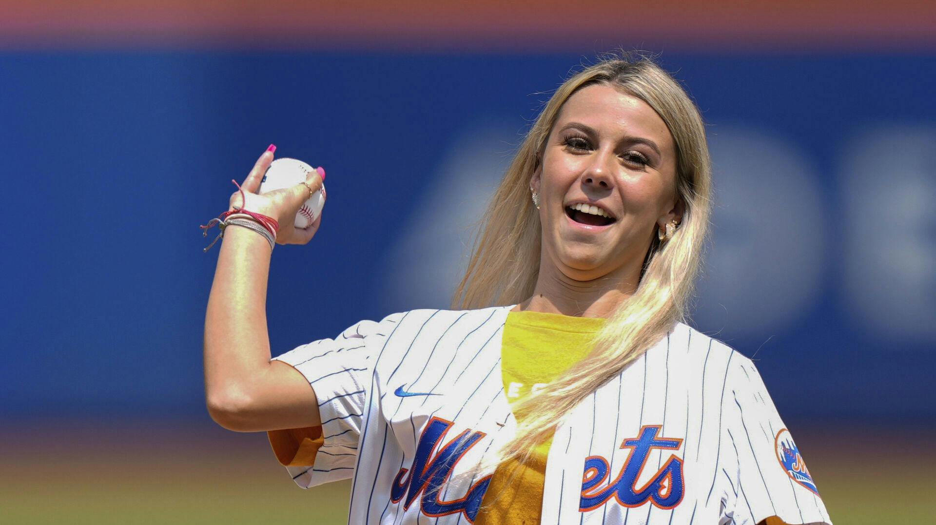 Hailey Welch throws out a ceremonial first pitch before a baseball game between the New York Mets and the Oakland Athletics, Thursday, Aug. 15, 2024, in New York. (AP Photo/Frank Franklin II)