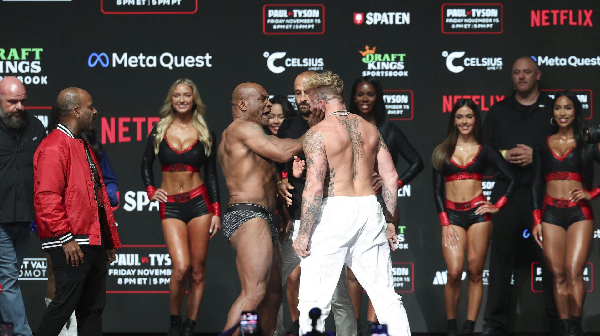 Nov 14, 2024; Irving, TX, USA; Mike Tyson slaps Jake Paul after weighing in at the Toyota Music Factory. Mandatory Credit: Kevin Jairaj-Imagn Images