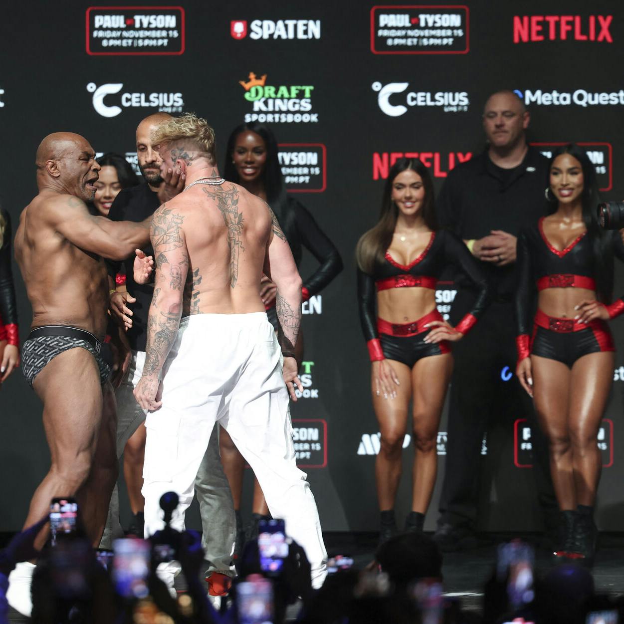 Nov 14, 2024; Irving, TX, USA; Mike Tyson slaps Jake Paul after weighing in at the Toyota Music Factory. Mandatory Credit: Kevin Jairaj-Imagn Images