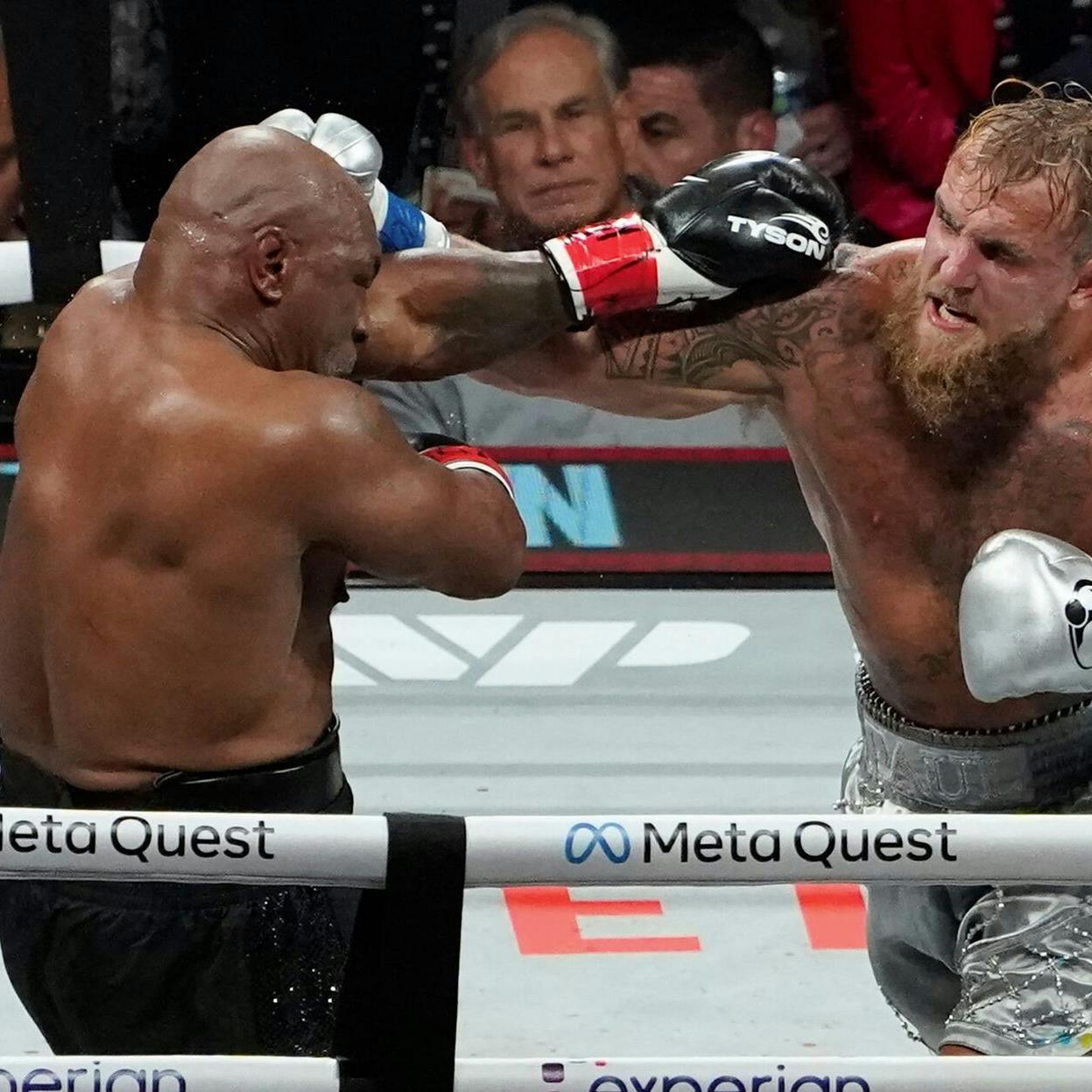 US retired pro-boxer Mike Tyson (L) and US YouTuber/boxer Jake Paul (R) fight during the heavyweight boxing bout at The Pavilion at AT&T Stadium in Arlington, Texas, November 15, 2024. (Photo by TIMOTHY A. CLARY / AFP)