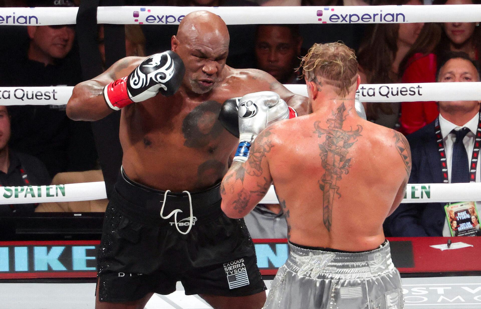 FILE PHOTO: Nov 15, 2024; Arlington, Texas, UNITED STATES; Mike Tyson (black gloves) fights Jake Paul (silver gloves) at AT&T Stadium. Mandatory Credit: Kevin Jairaj-Imagn Images/File Photo