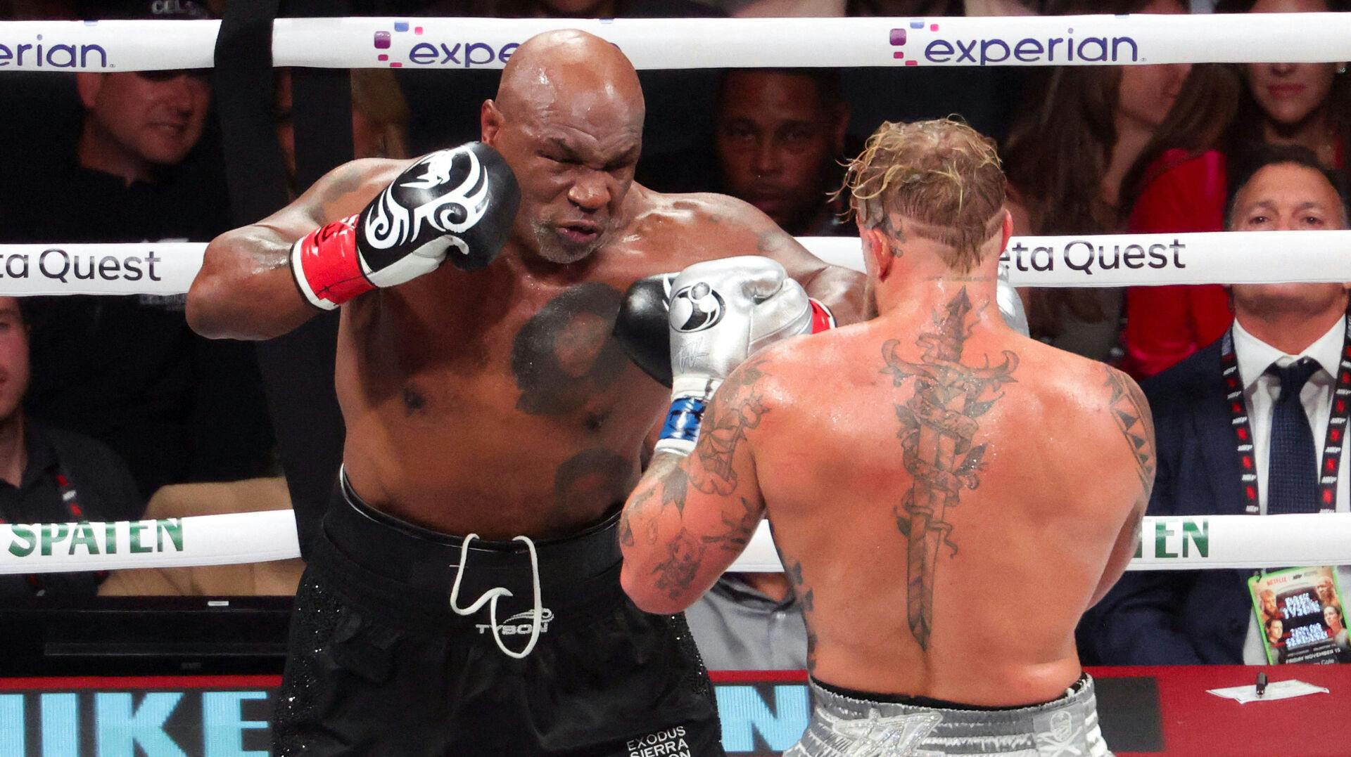 FILE PHOTO: Nov 15, 2024; Arlington, Texas, UNITED STATES; Mike Tyson (black gloves) fights Jake Paul (silver gloves) at AT&T Stadium. Mandatory Credit: Kevin Jairaj-Imagn Images/File Photo