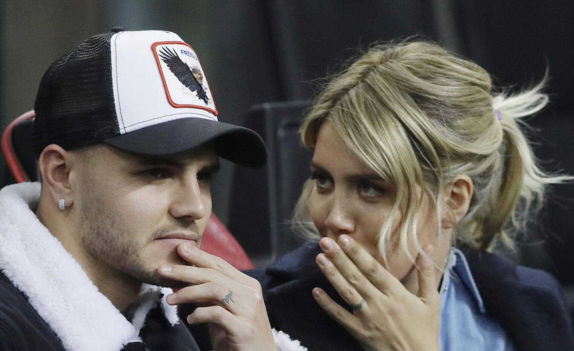 Inter Milan's Mauro Icardi is flanked by his wife Wanda Nara during the Europa League, round of 32, second leg soccer match between Inter Milan and SK Rapid Vienna, at the San Siro stadium in Milan, Italy, Thursday, Feb. 21, 2019. (AP Photo/Luca Bruno)