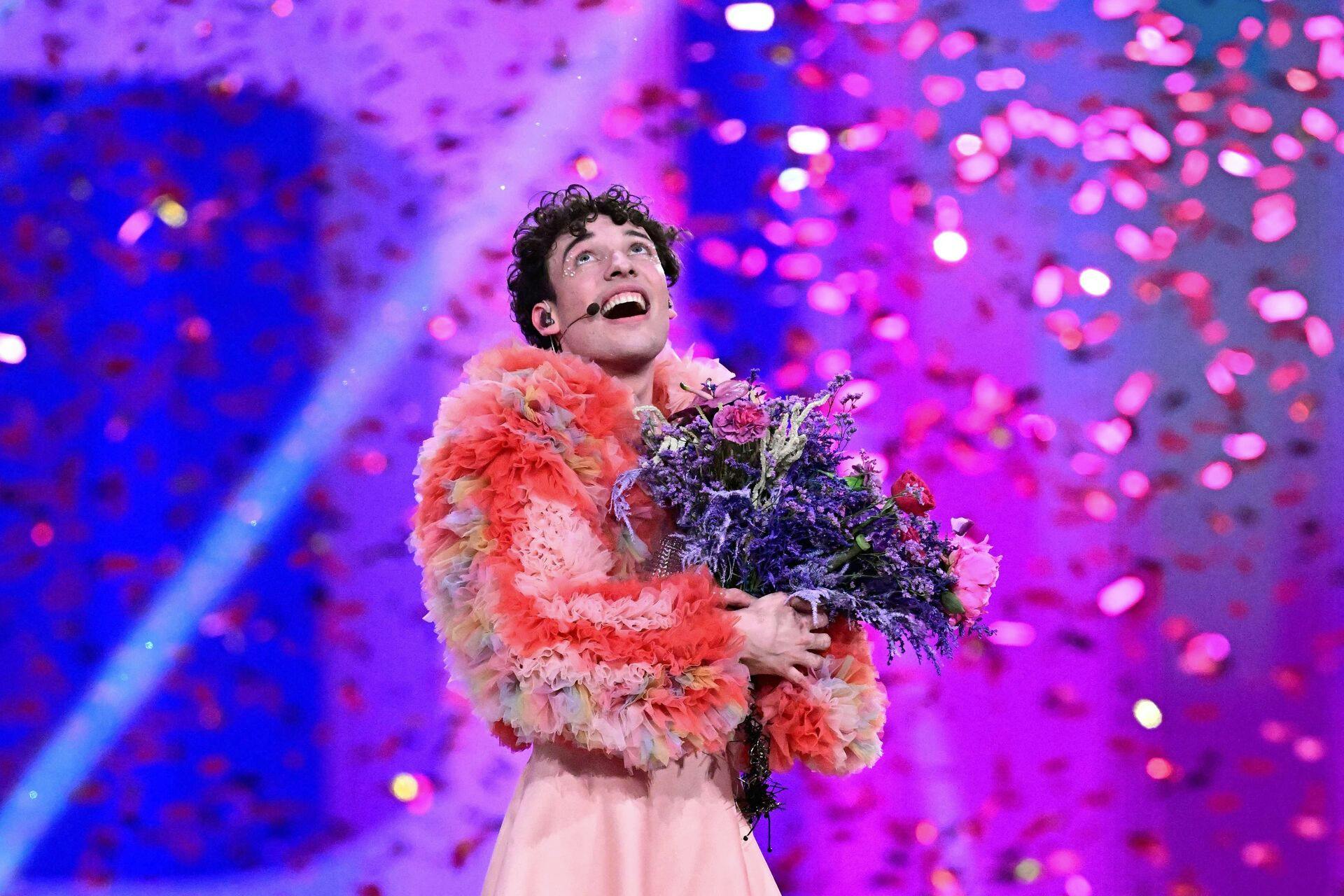 TOPSHOT - Swiss singer Nemo representing Switzerland with the song "The Code" celebrates on stage after winning the final of the 68th Eurovision Song Contest (ESC) 2024 on May 11, 2024 at the Malmo Arena in Malmo, Sweden. (Photo by Tobias SCHWARZ / AFP)