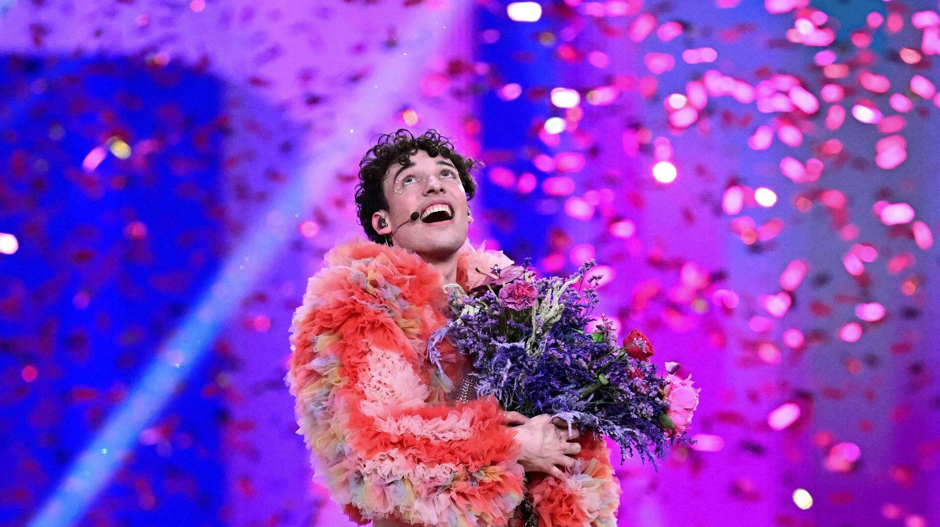 TOPSHOT - Swiss singer Nemo representing Switzerland with the song "The Code" celebrates on stage after winning the final of the 68th Eurovision Song Contest (ESC) 2024 on May 11, 2024 at the Malmo Arena in Malmo, Sweden. (Photo by Tobias SCHWARZ / AFP)