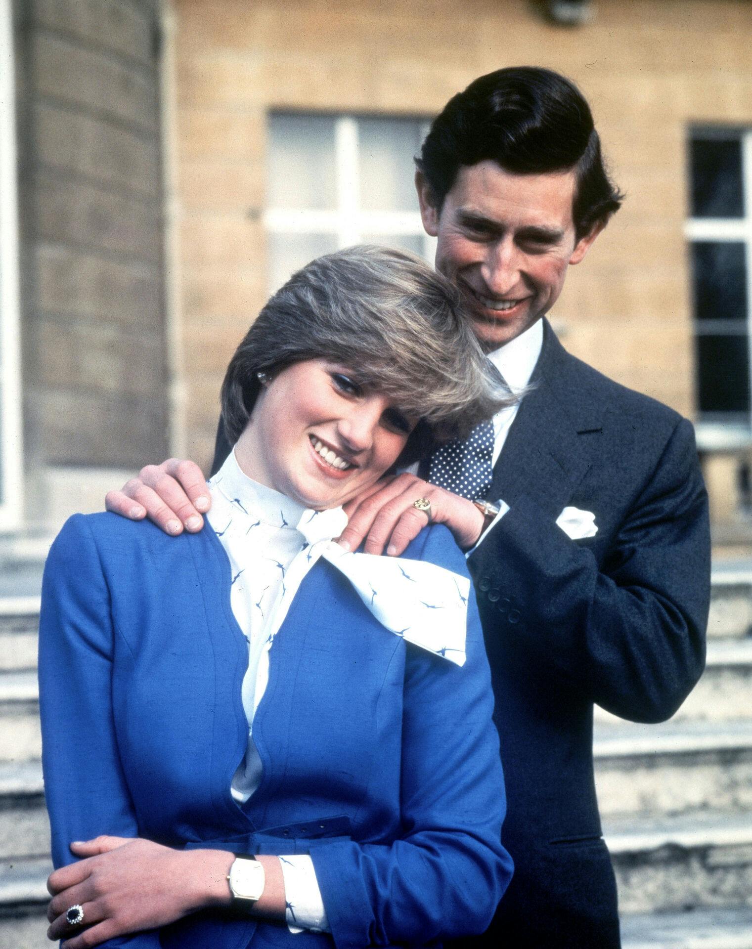 FILE - In this Feb. 24, 1981 file photo Britain's Prince Charles and Lady Diana Spencer pose following the announcement of their engagement. Princess Diana died in a Paris car crash in 1997 after a messy divorce from Charles that for a time tarnished his standing with the British public, but as Prince Charles turns 70 Wednesday Nov. 14, 2018, he has recently taken a more visible role representing the queen at some important national events. (AP Photo/Pool, File)