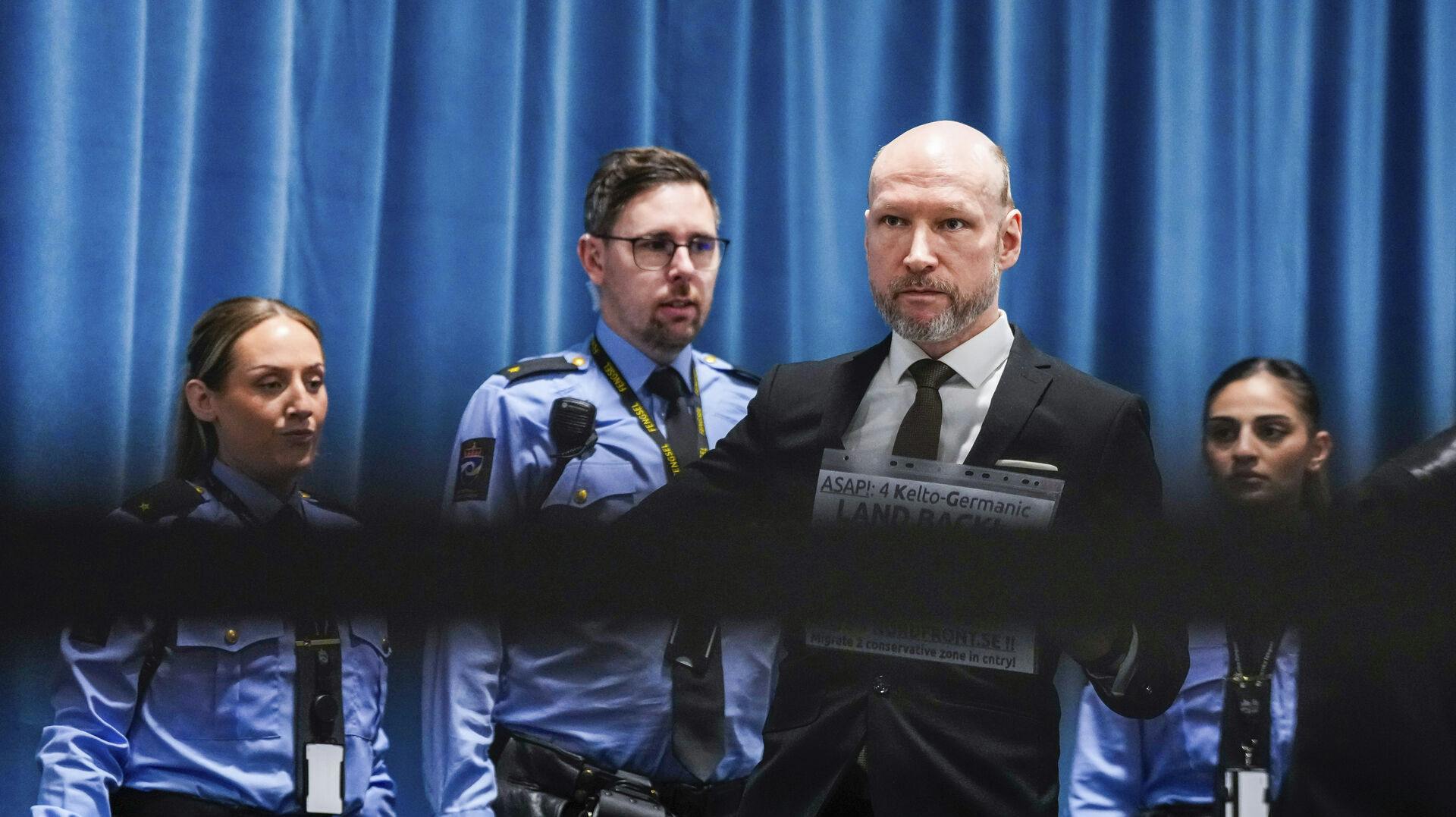 Anders Behring Breivik arrives at the courtroom for day one of the Ringerike, Asker and Bærum district court's processing of Fjotolf Hansen's petition for parole, in Tyristrand, Norway, Tuesday, Nov. 19, 2024. (Beate Oma Dahle/NTB Scanpix via AP)