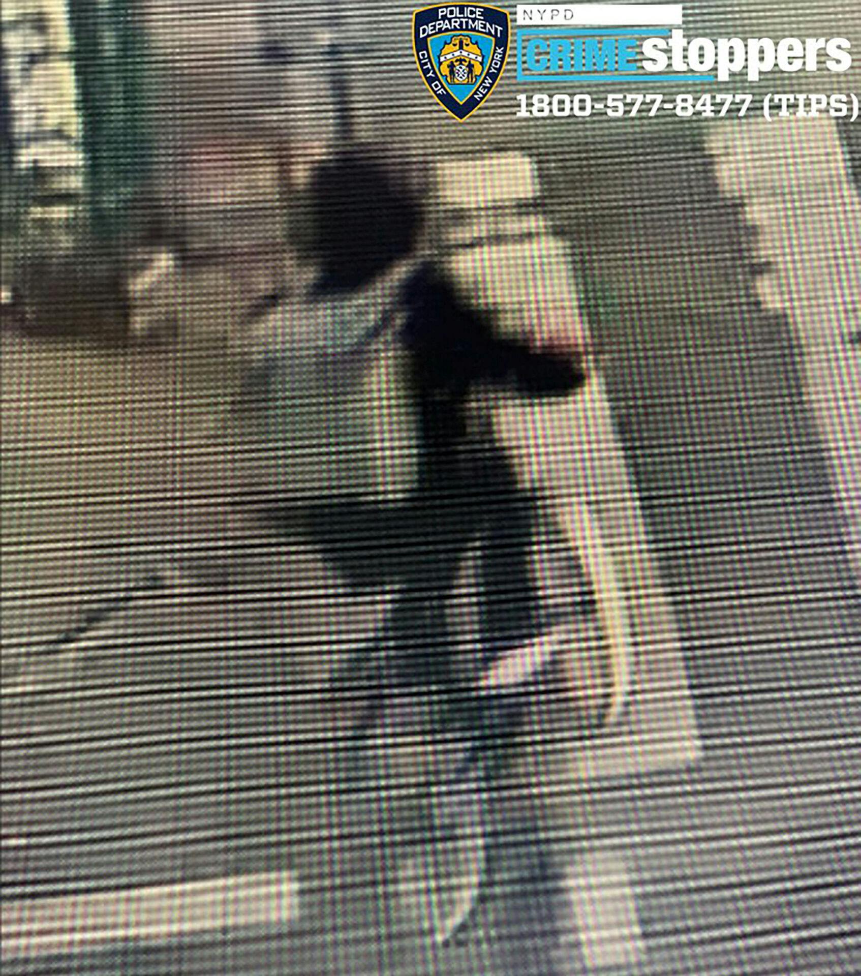 An image of the individual sought in connection to the investigation of the shooting death of Brian Thompson, the CEO of UnitedHealth's insurance unit, is seen in a still image from surveillance video taken outside a hotel in the Manhattan borough of New York City, U.S. December 4, 2024. NYPD News/Handout via REUTERS. THIS IMAGE HAS BEEN SUPPLIED BY A THIRD PARTY