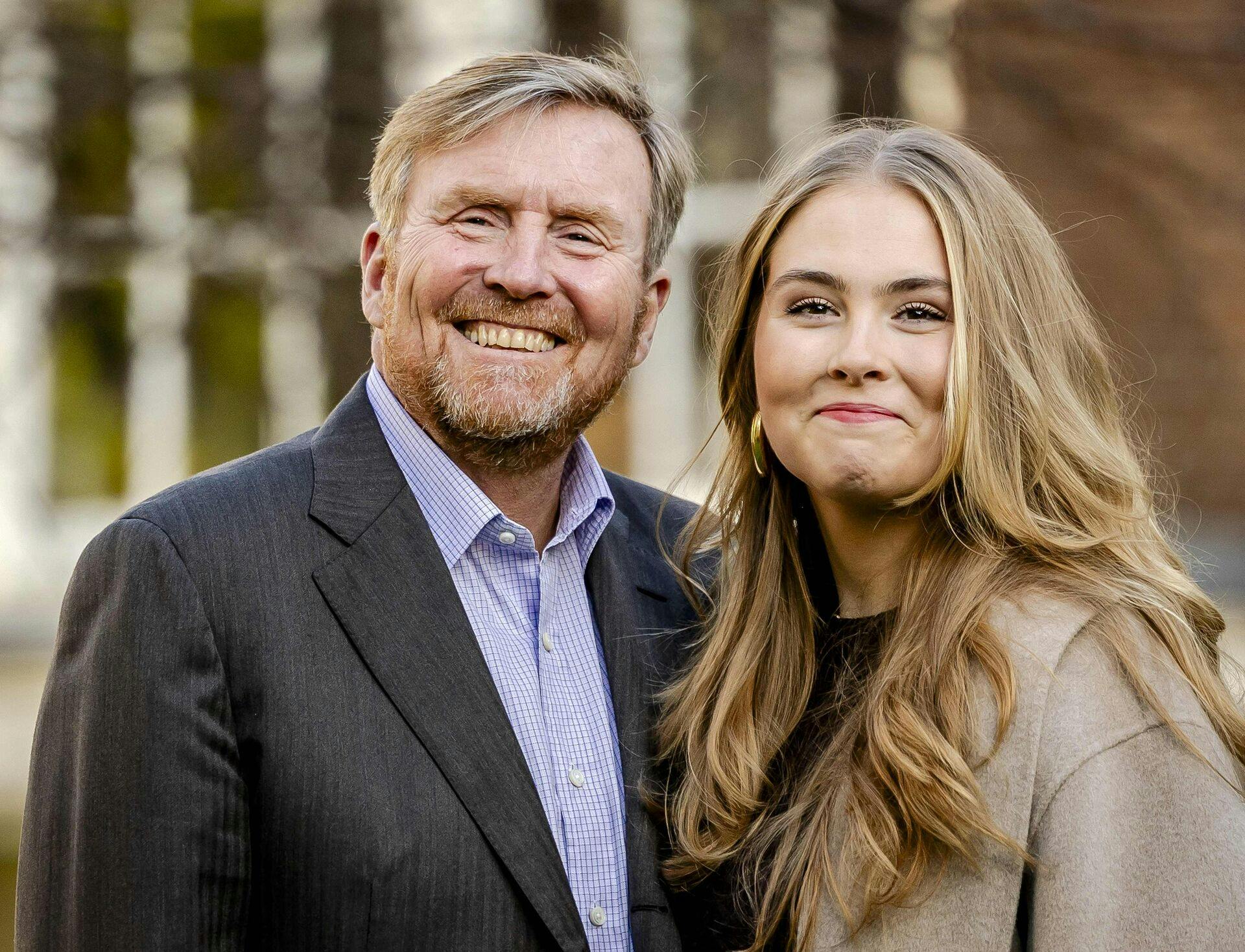 King Willem-Alexander (L) poses with Princess Amalia for the traditional photo session of the royal family at the Begijnhof in Amsterdam, on November 29, 2024. (Photo by Remko de Waal / ANP / AFP) / Netherlands OUT