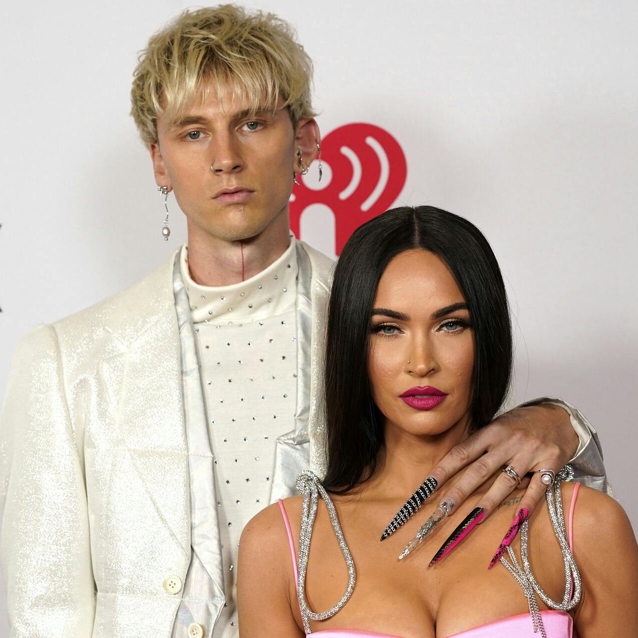 FILE - Megan Fox, right, and Machine Gun Kelly attend the iHeartRadio Music Awards on May 27, 2021, in Los Angeles. (AP Photo/Chris Pizzello, File)
