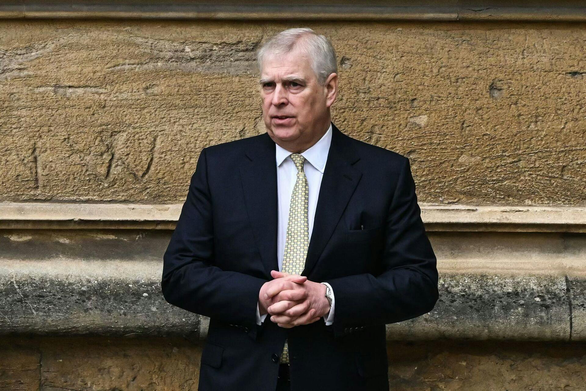 (FILES) Britain's Prince Andrew, Duke of York reacts as he arrives at St. George's Chapel, Windsor Castle, to attend the Easter Mattins Service, on March 31, 2024. A former UK security minister said Friday, december 13, that it was "extremely embarrassing" that a suspected Chinese spy had become a confidant of disgraced royal Prince Andrew. (Photo by JUSTIN TALLIS / AFP)