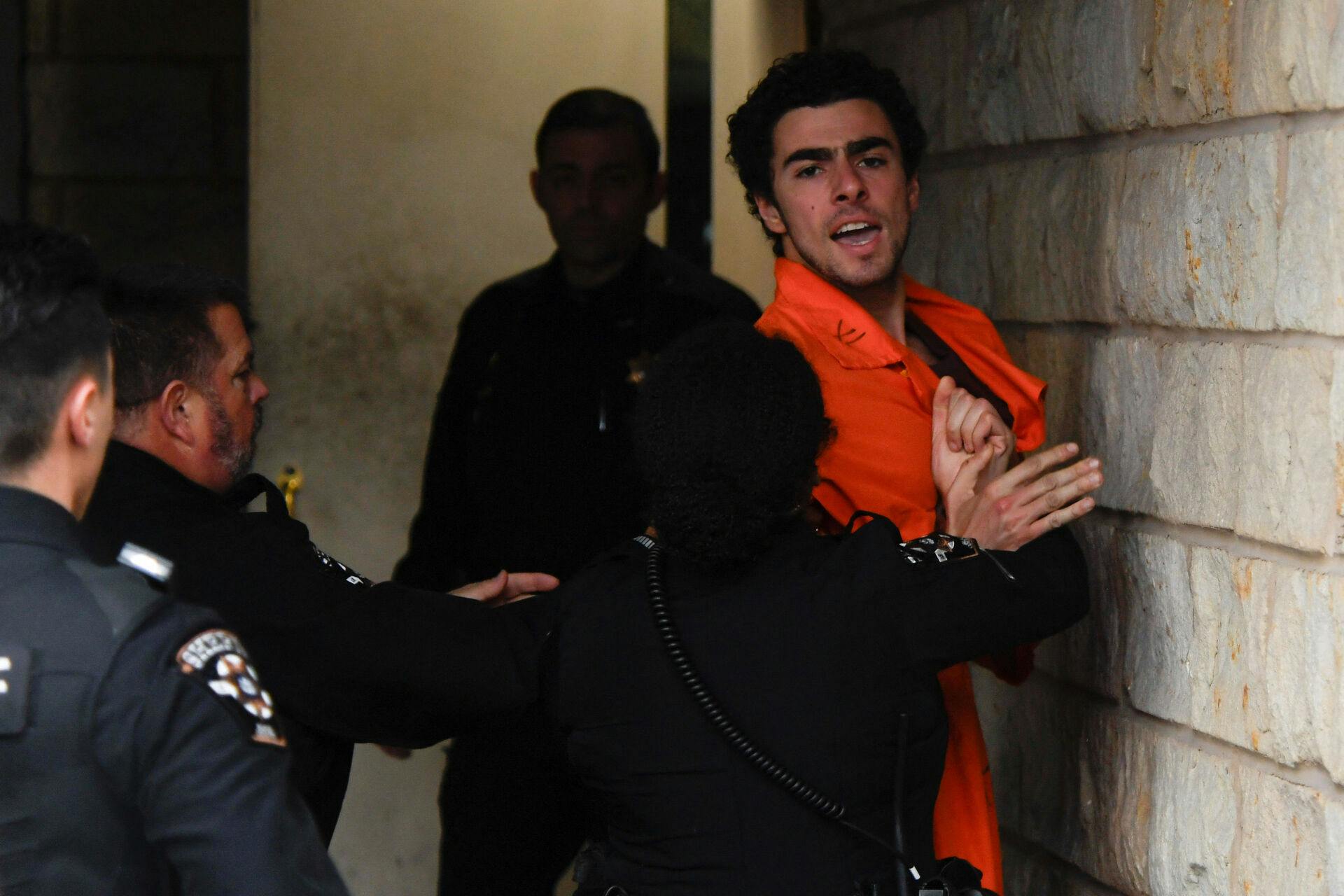 Luigi Mangione, 26, a suspect in the New York City killing of UnitedHealth executive Brian Thompson, arrives for an extradition hearing at Blair County Court House in Hollidaysburg, Pennsylvania, U.S. December 10, 2024. REUTERS/Matthew Hatcher