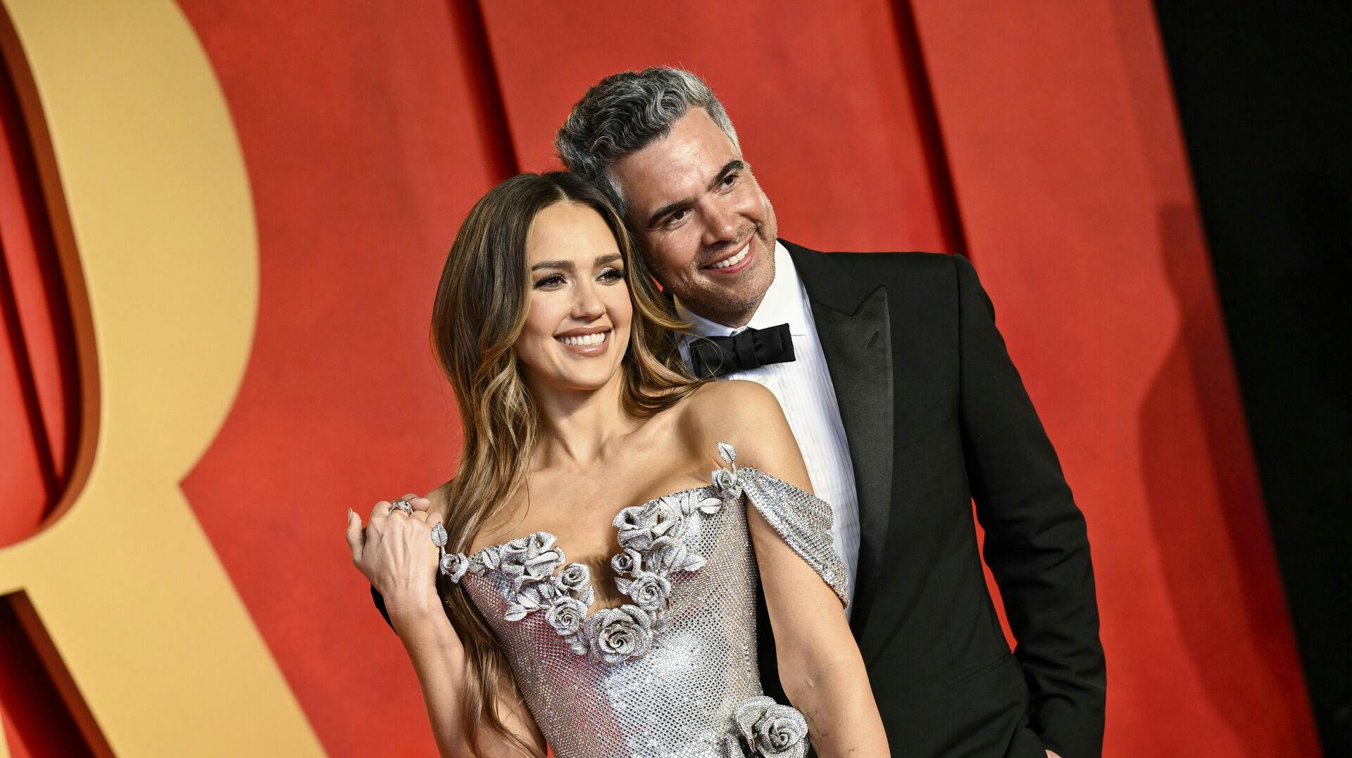Jessica Alba, left, and Cash Warren arrive at the Vanity Fair Oscar Party on Sunday, March 10, 2024, at the Wallis Annenberg Center for the Performing Arts in Beverly Hills, Calif. (Photo by Evan Agostini/Invision/AP)