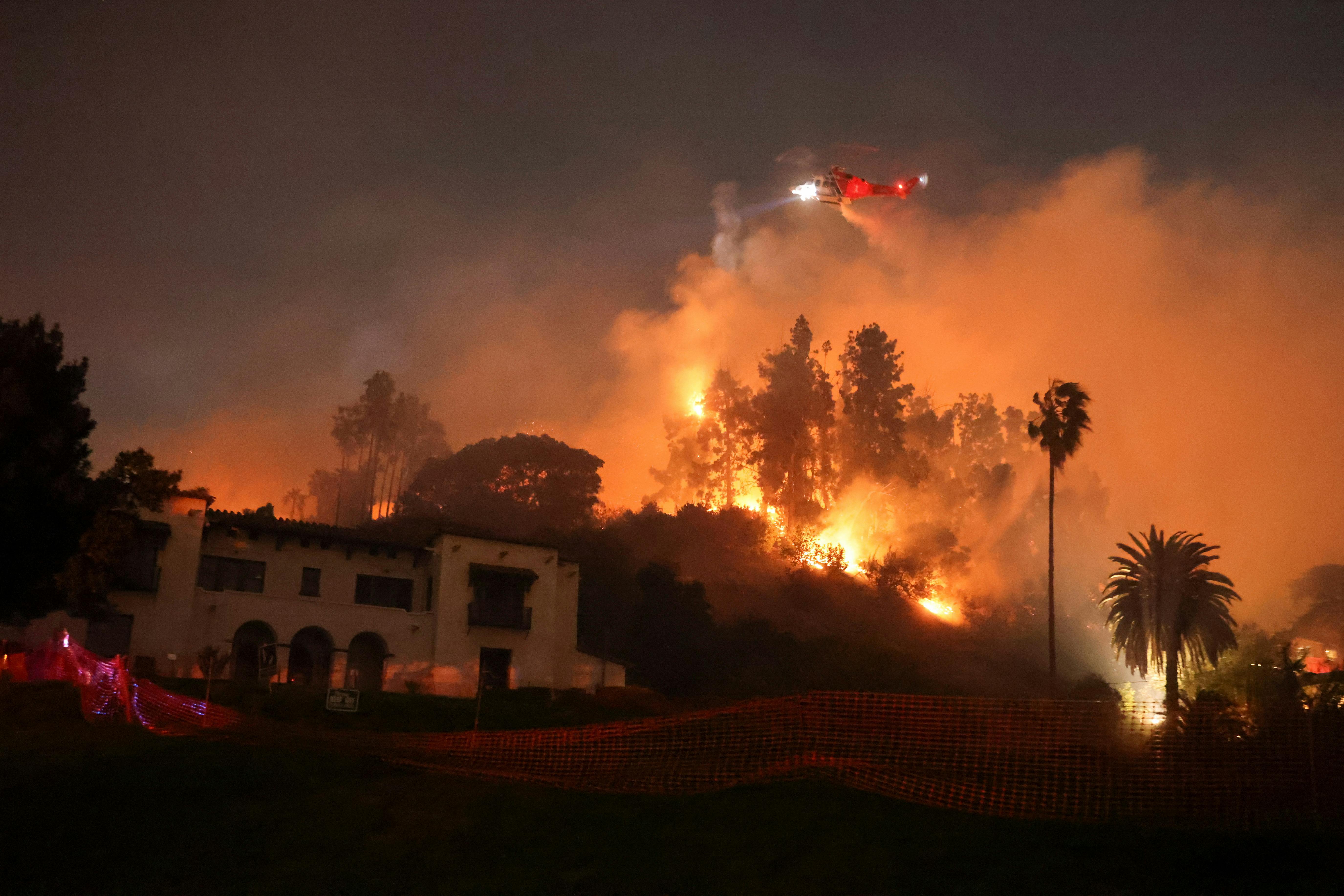 Flames rise from the Sunset Fire in the hills overlooking the Hollywood neighborhood of Los Angeles, California, U.S. January 8, 2025. REUTERS/David Swanson