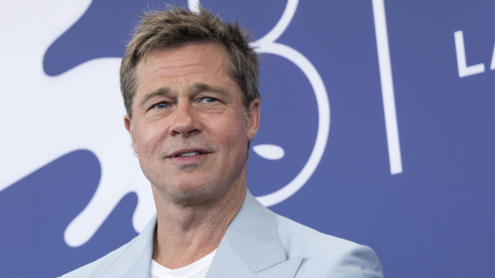 Brad Pitt poses for photographers at the photo call for the film 'Wolfs' during the 81st edition of the Venice Film Festival in Venice, Italy, on Sunday, Sept. 1, 2024. (Photo by Joel C Ryan/Invision/AP)