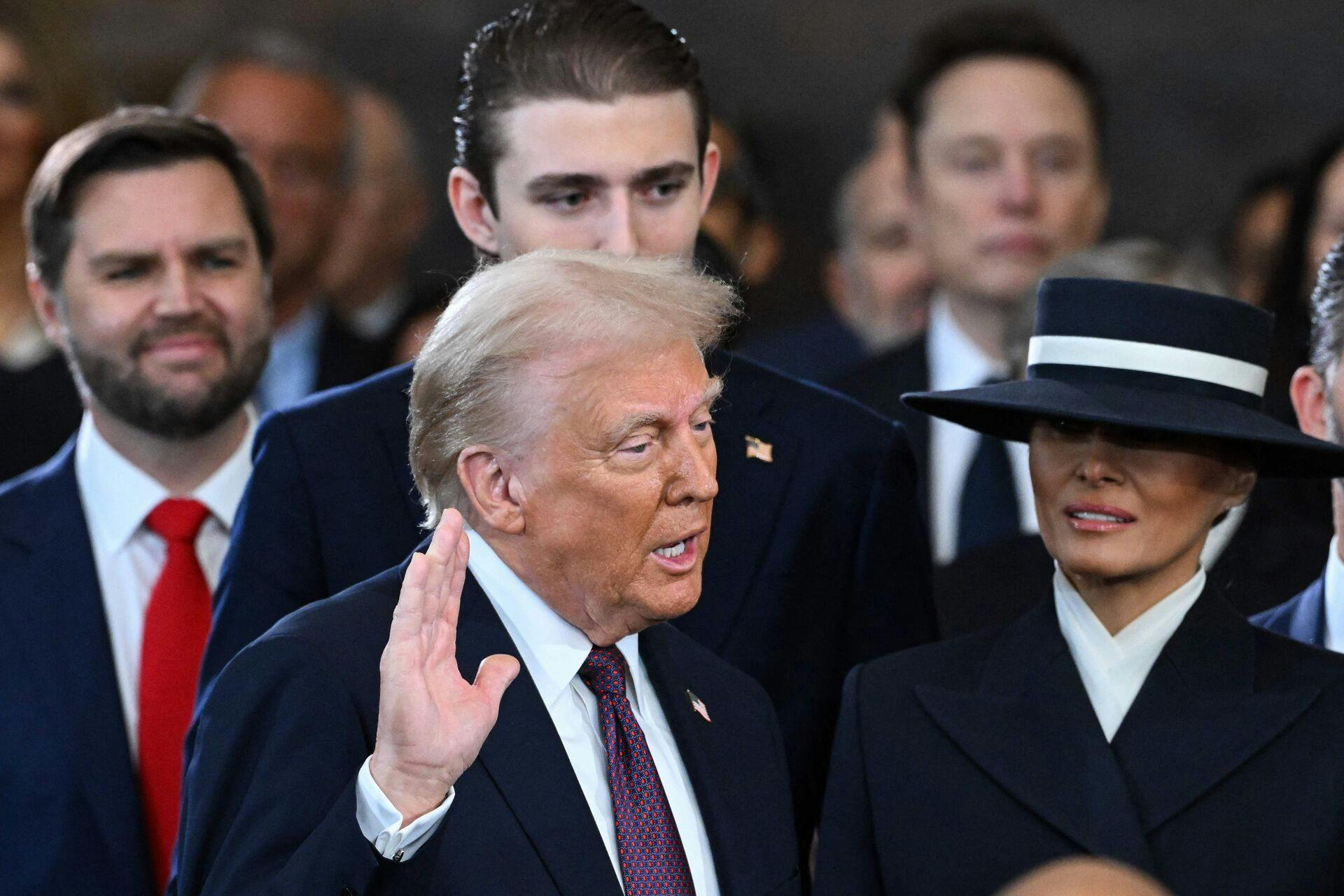 TOPSHOT - Donald Trump is sworn in as the 47th US President in the US Capitol Rotunda in Washington, DC, on January 20, 2025. (Photo by SAUL LOEB / POOL / AFP)